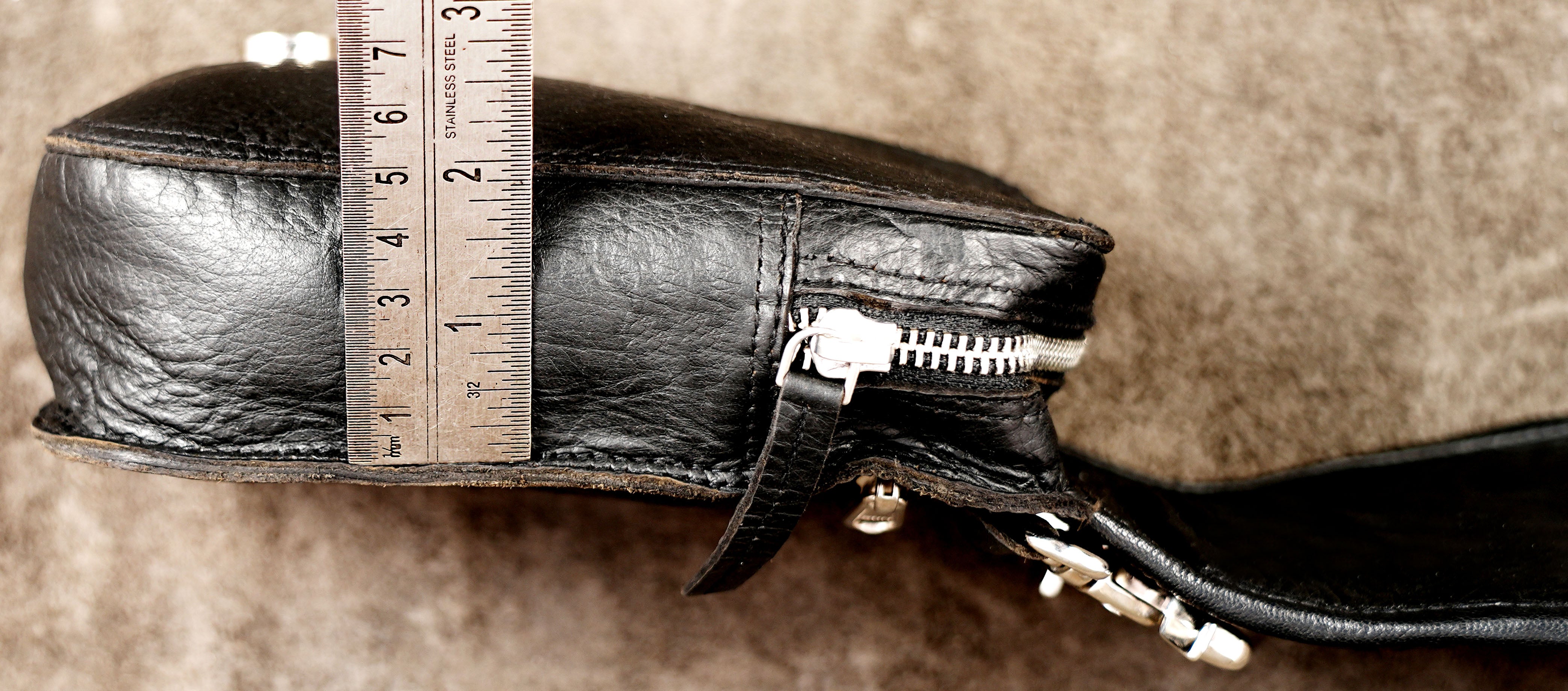 Artisan leather waist bag with detailed hand stitching