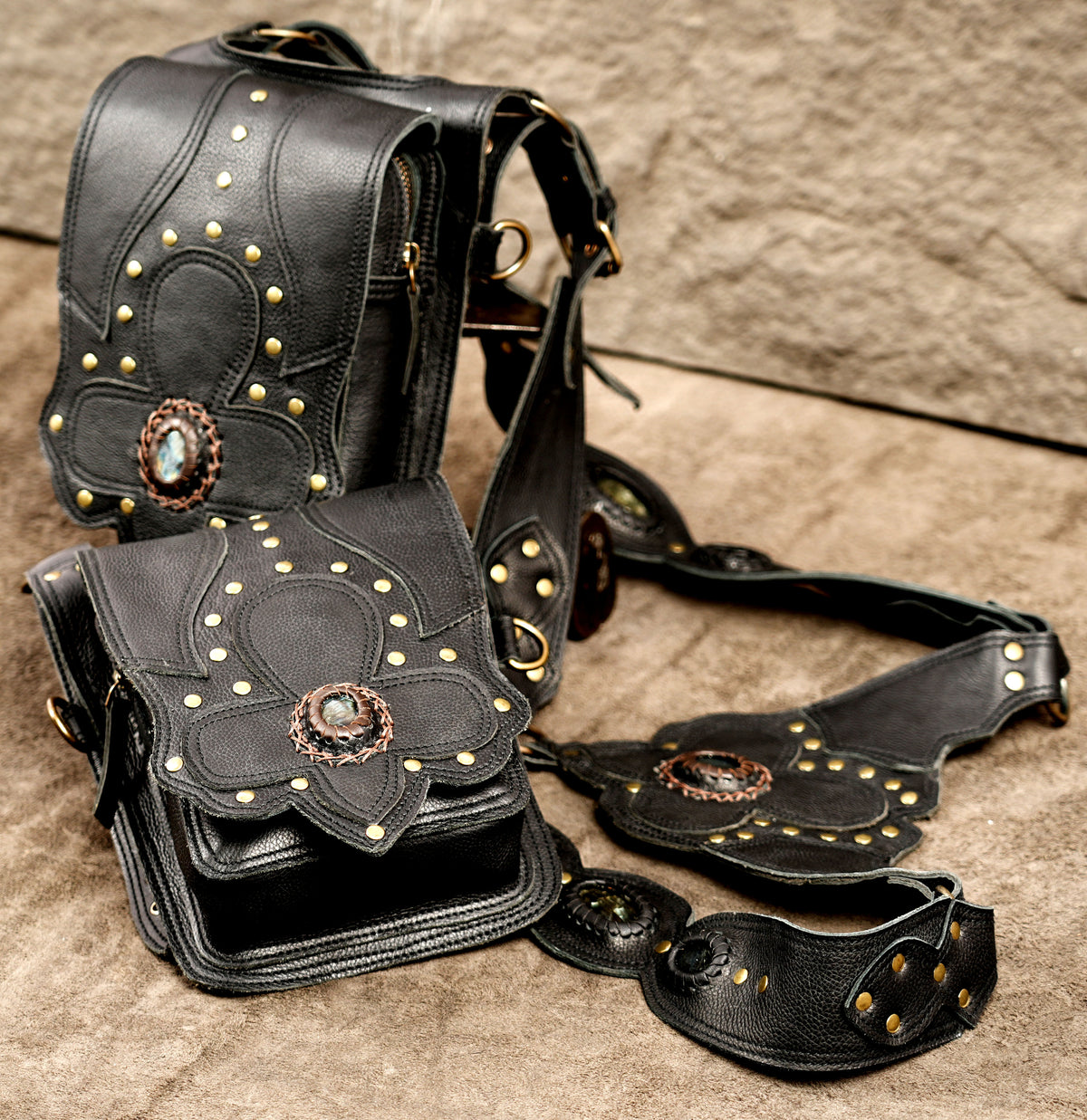 Black leather utility harness bag with two pouches and antique brass buckles