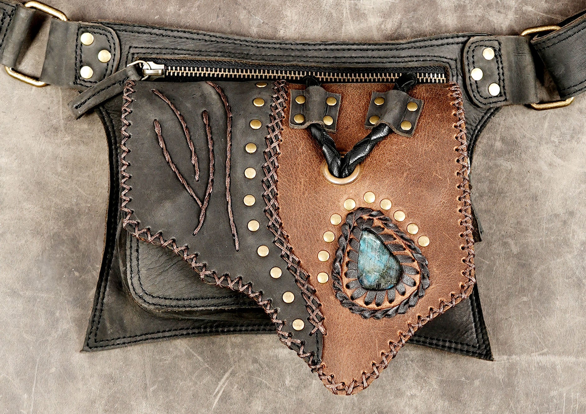 Black and brown leather hip bag with multiple secure pockets