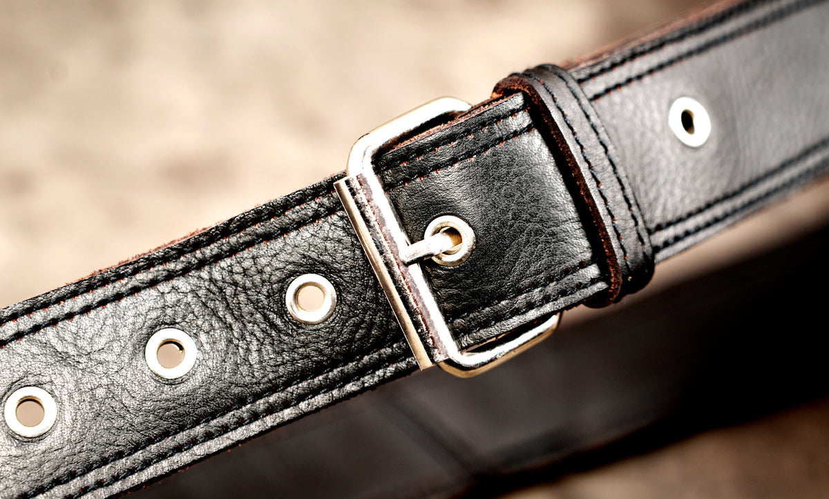 Black festival belt bag with front flap pocket and zipper