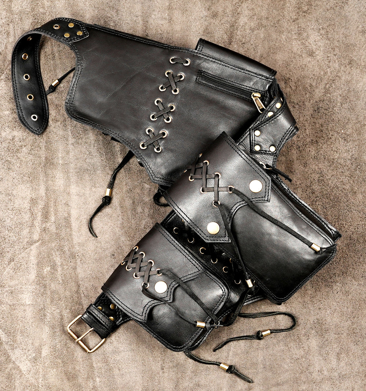 Black leather hip bag belt with four compartments and drawstring ties