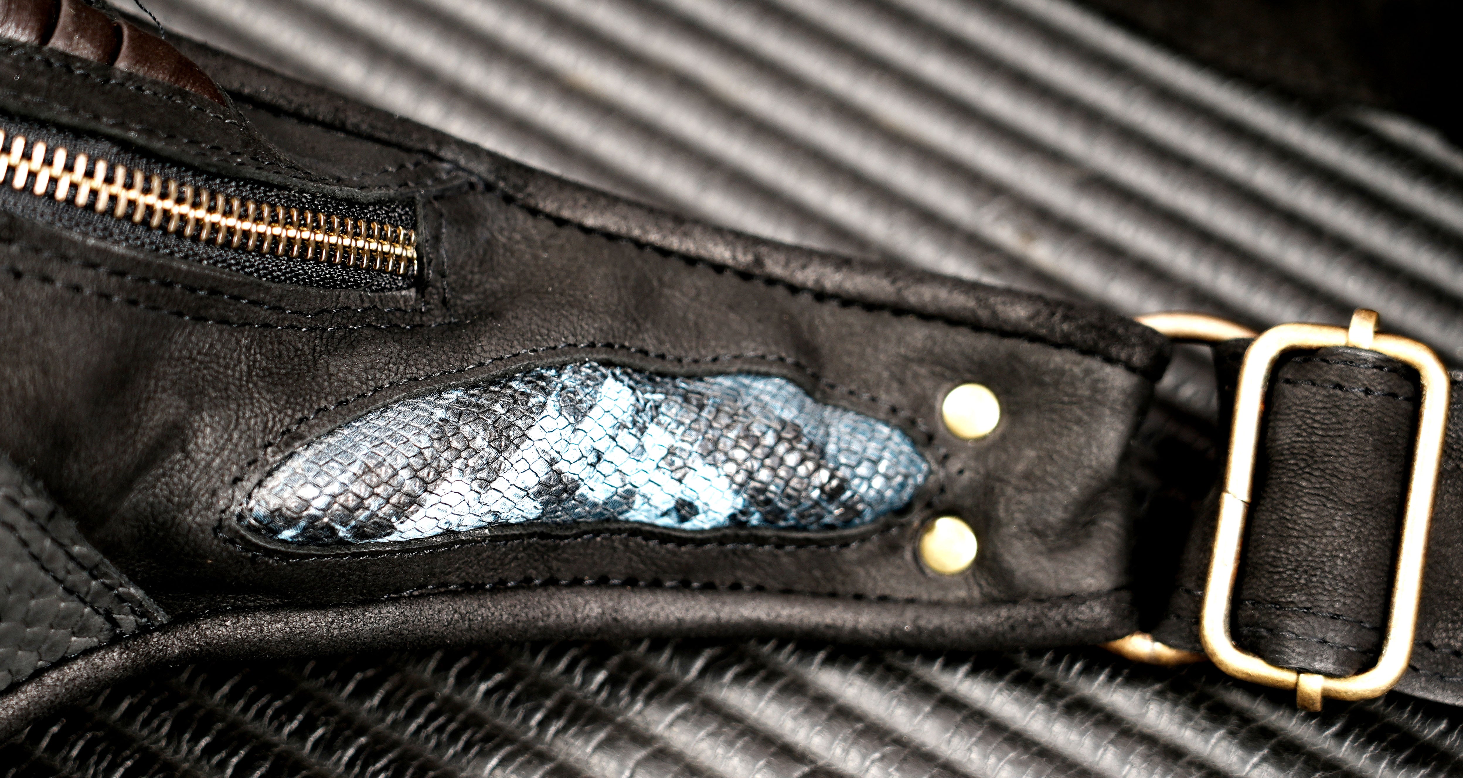 Black leather biker thigh bag with multiple compartments
