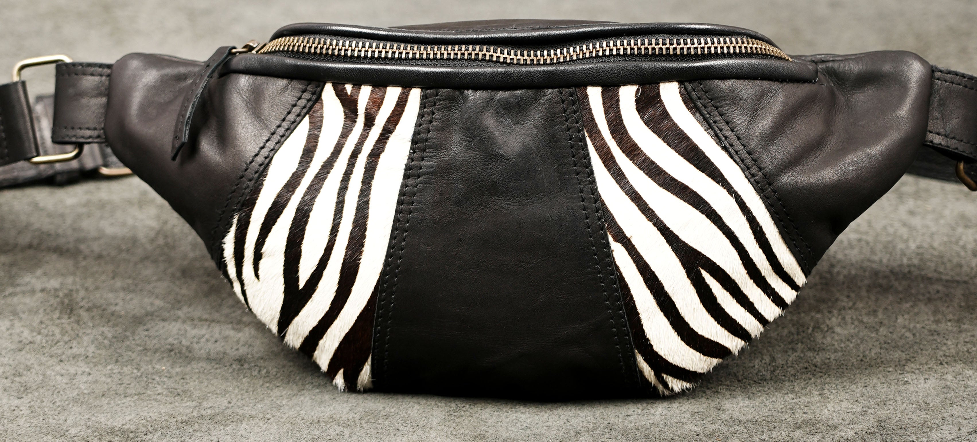 Black leather crossbody bag with antique brass hardware