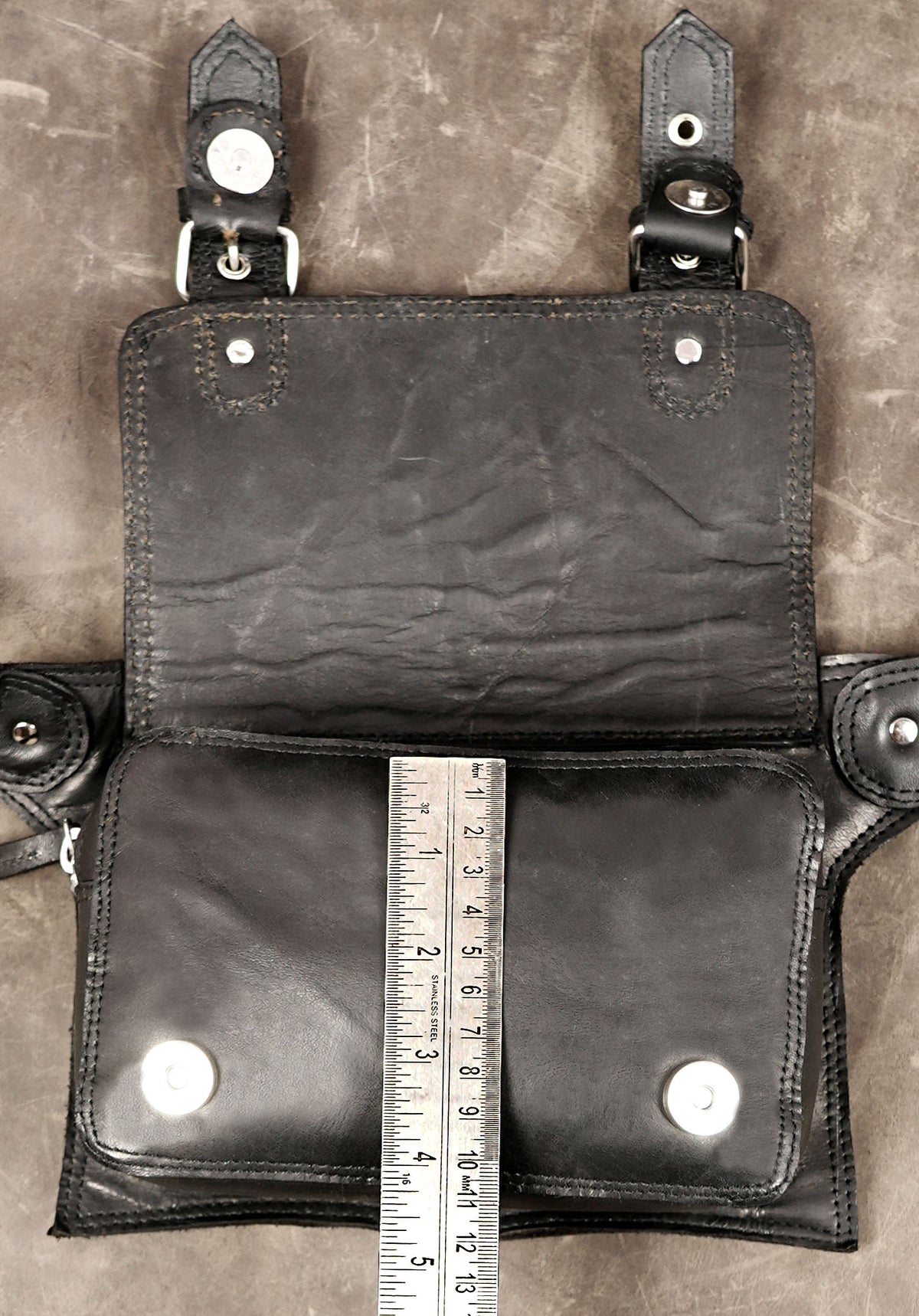 Black leather crossbody pouch with double buckle detail