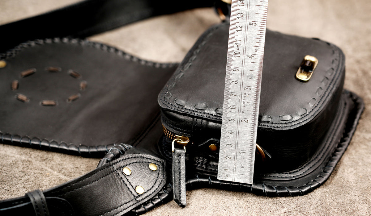 Leather festival belt bag with front flap and decorative metal studs