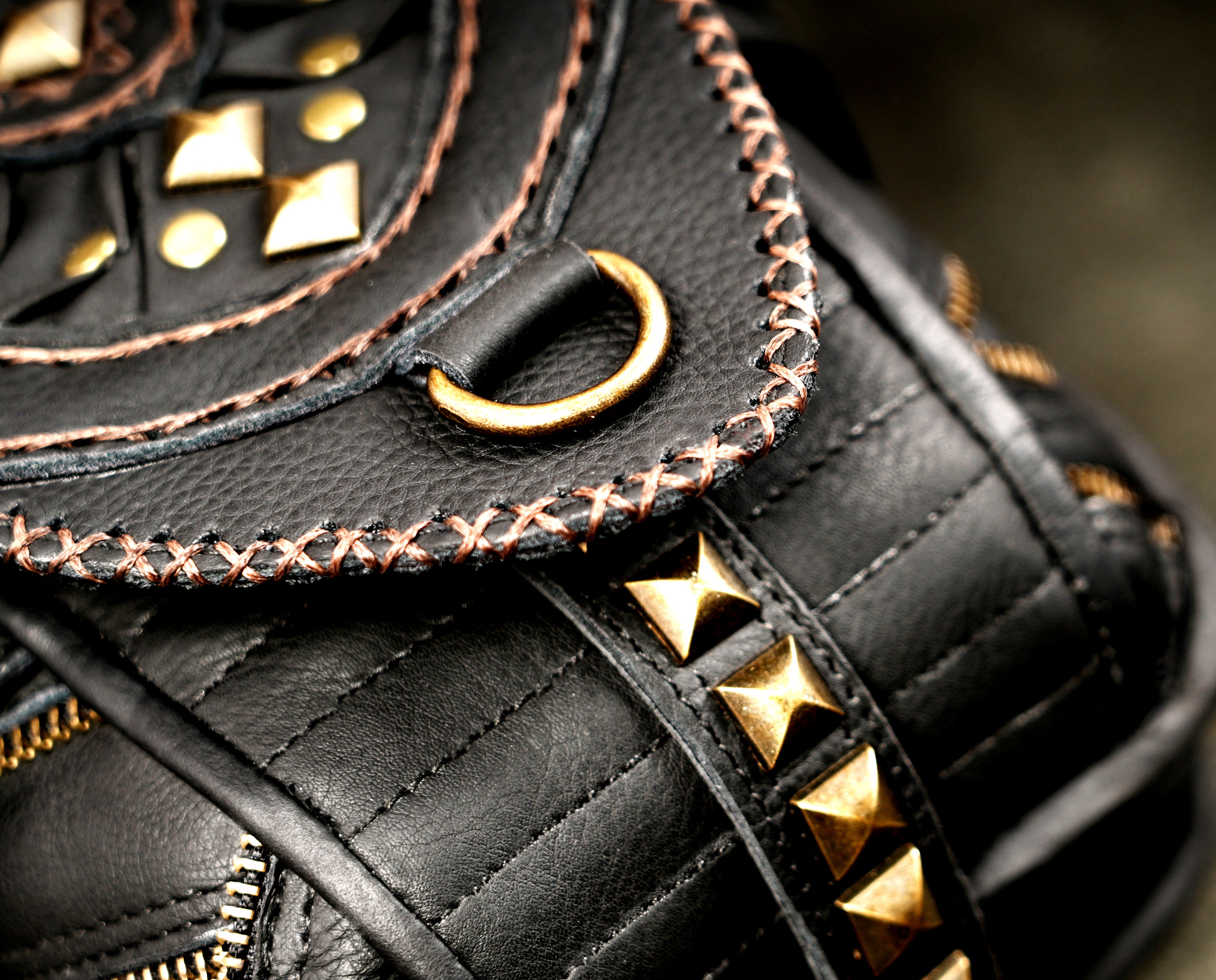 Black leather festival shoulder bag with decorative gemstone accents
