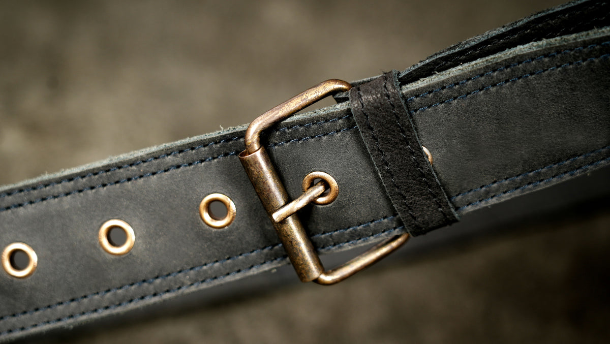 Black suede belt bag with gemstone detail