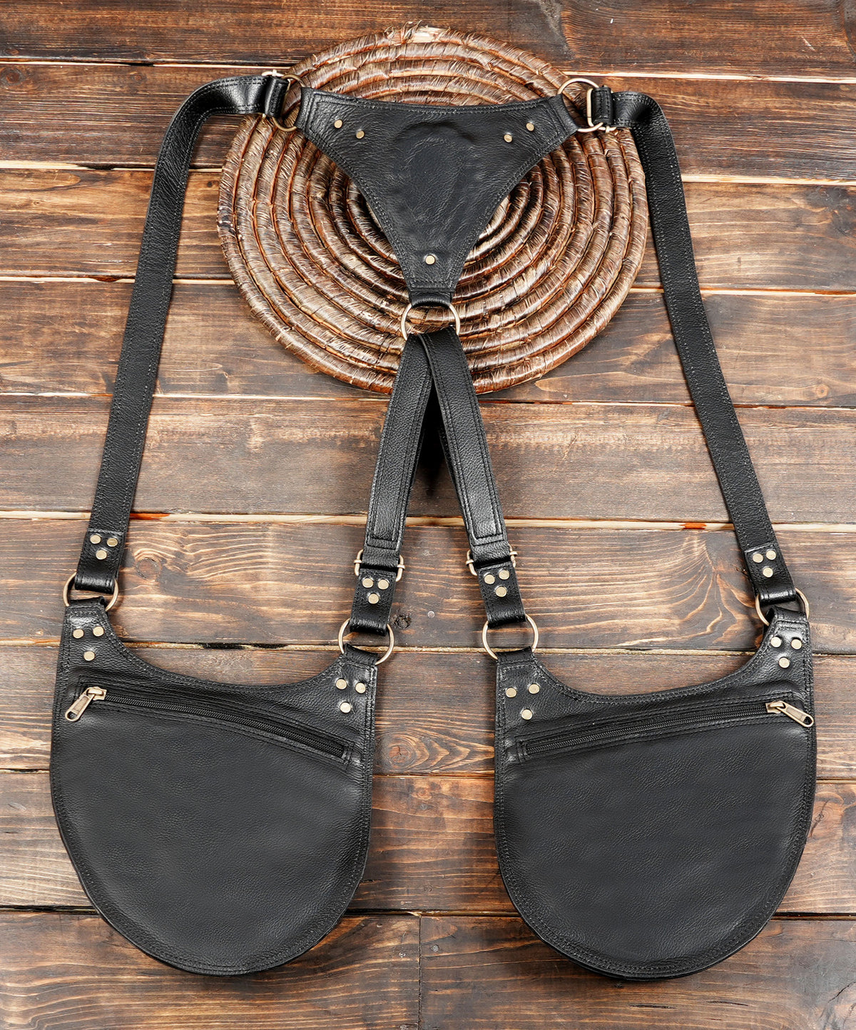 Black leather double hip pouches with shoulder straps and front zip pockets.