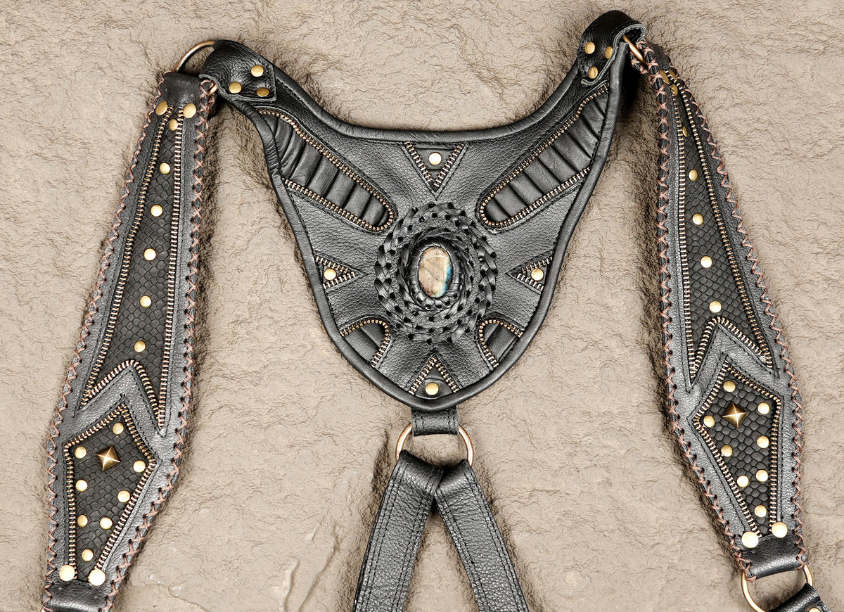 Steampunk black leather shoulder holster set with decorative stitching and studs