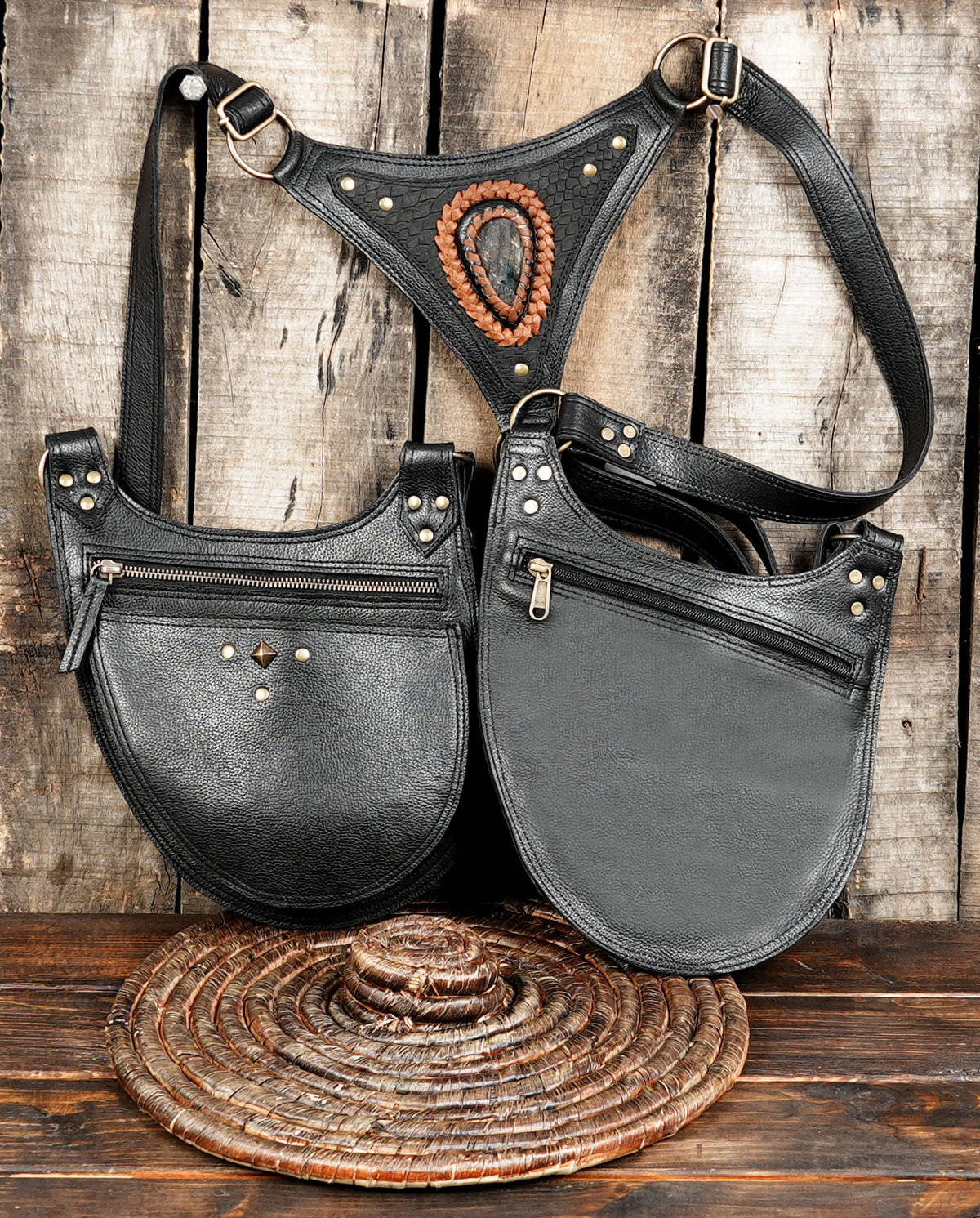 Black leather festival holster with two front pouches and adjustable straps for men and women.