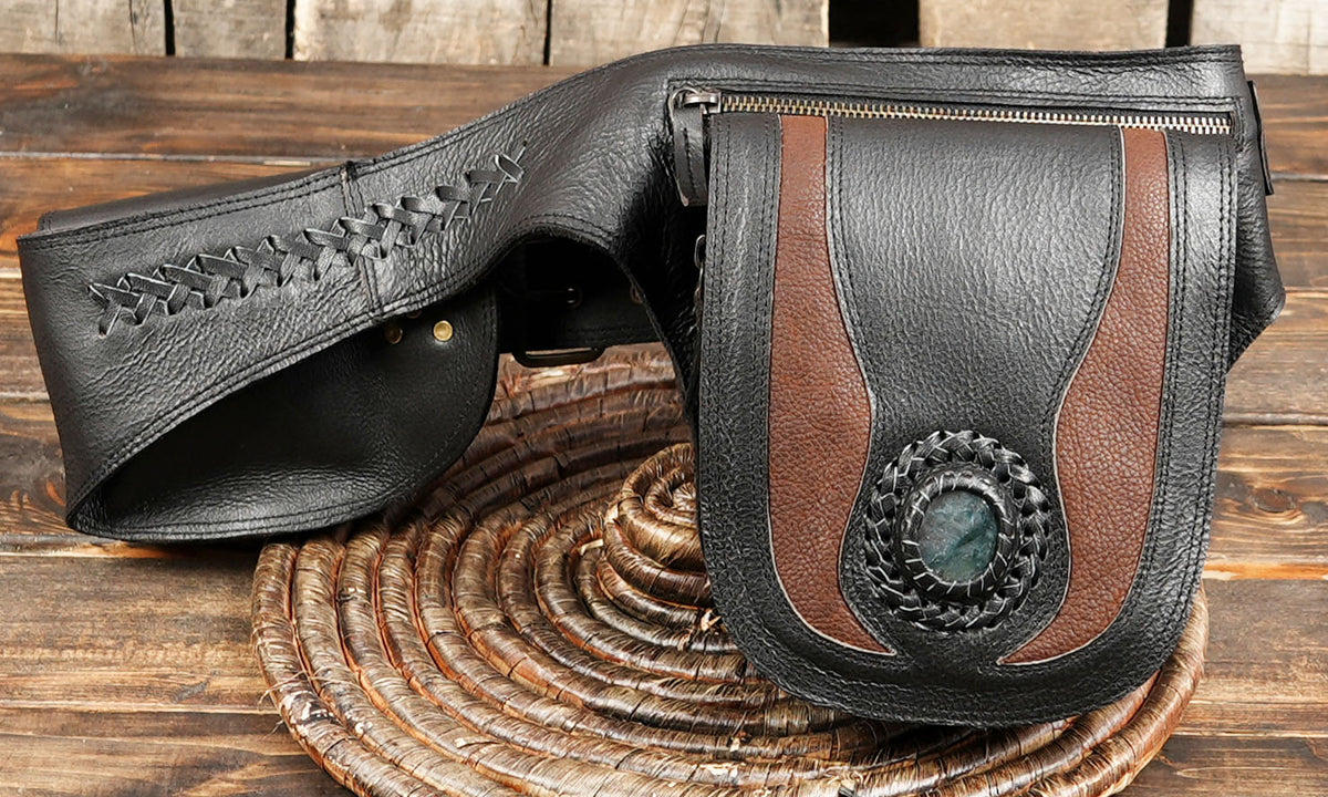 Multi-pocket leather utility pouch belt with adjustable buckle clasp on dark wooden tabletop