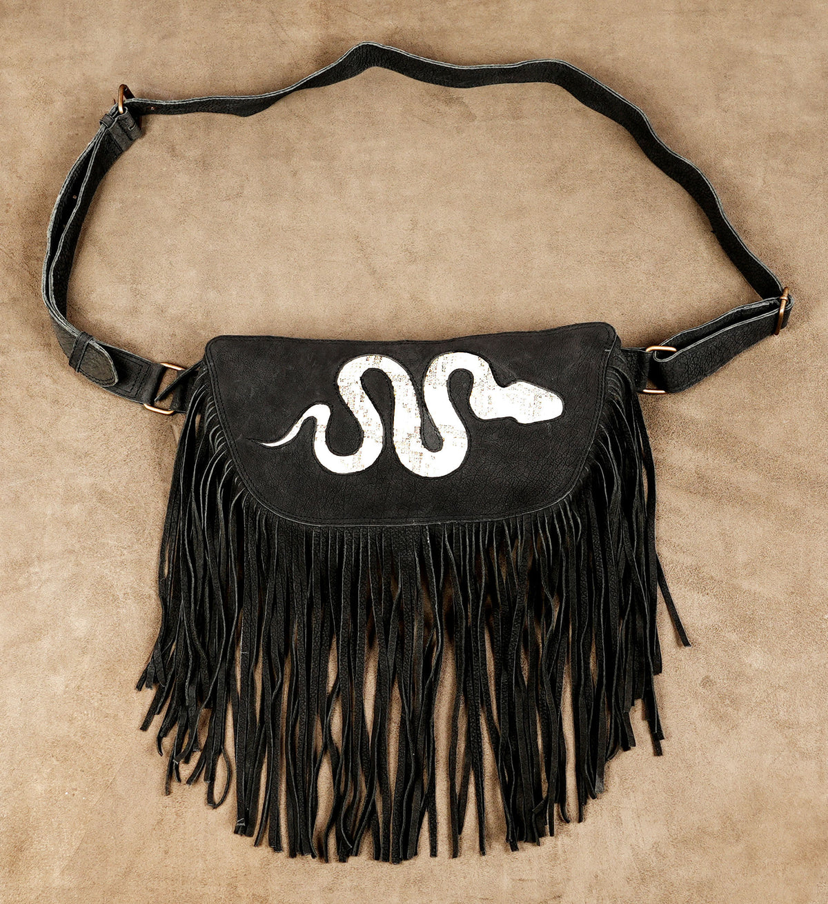 Black fringe utility hip pouch with white snake design for Burning Man accessories.