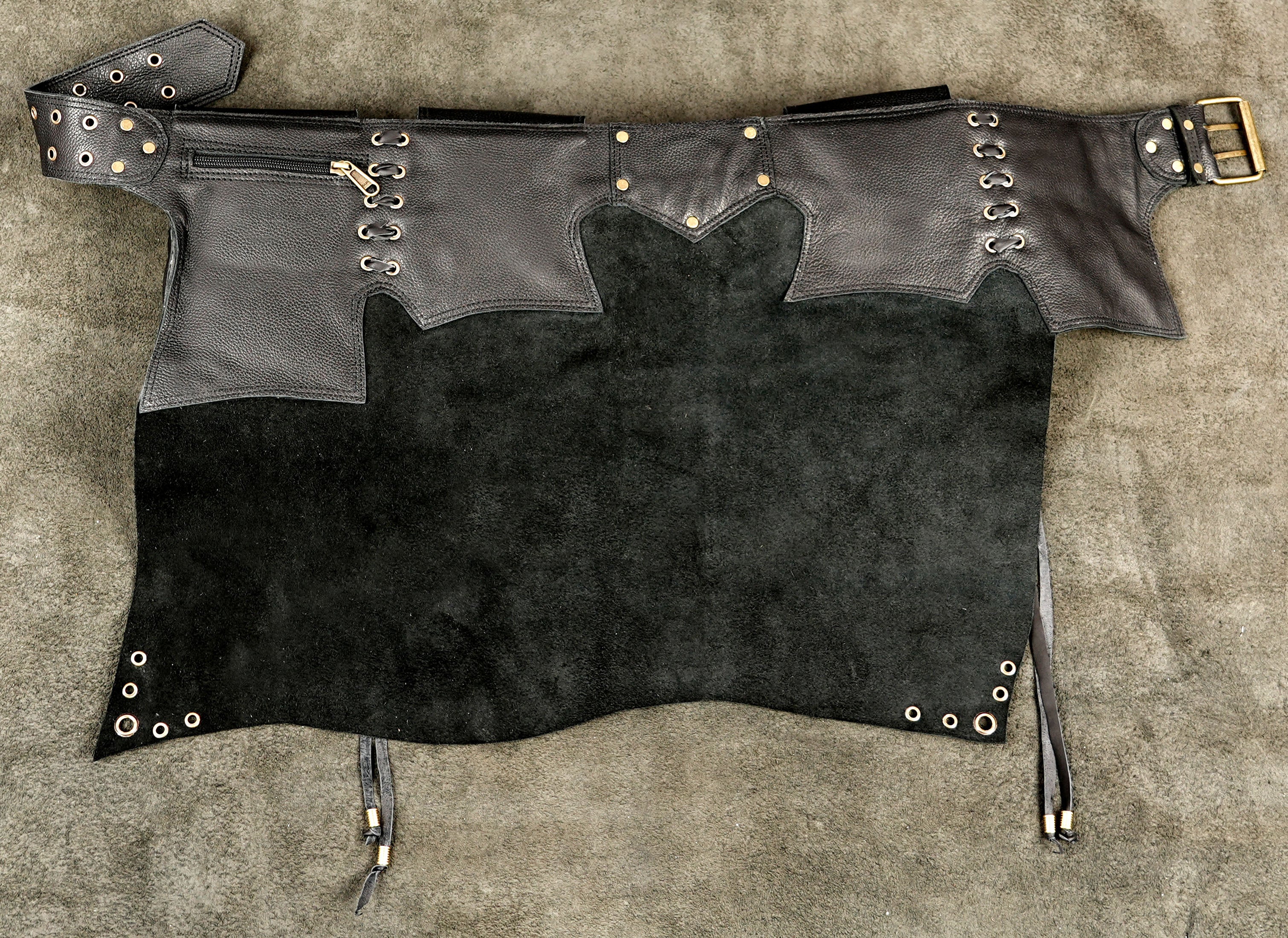Boho apocalyptic leather skirt with spiral accent, close up