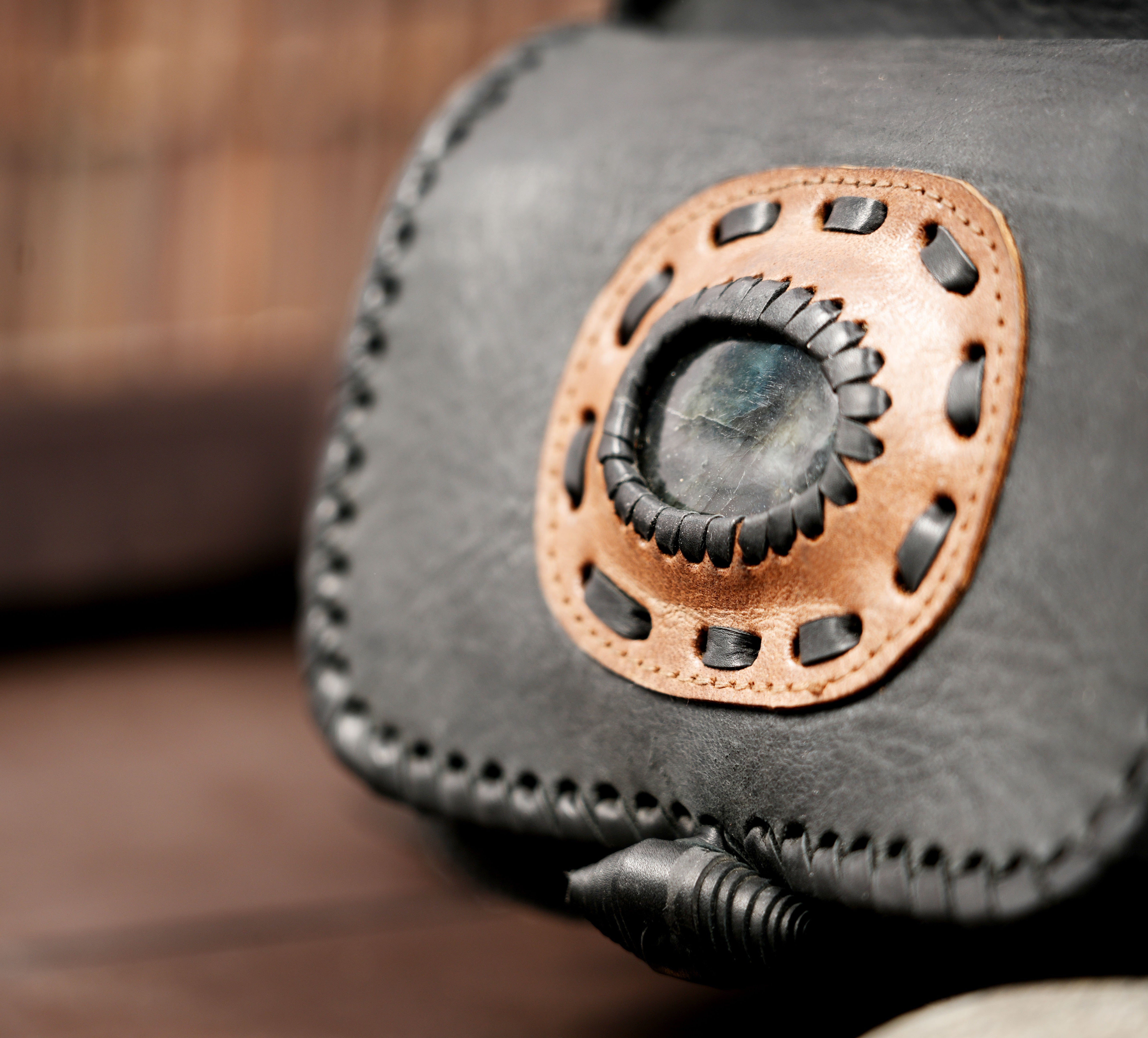 Boho leather hip bag with whipstitch trim and natural crystal