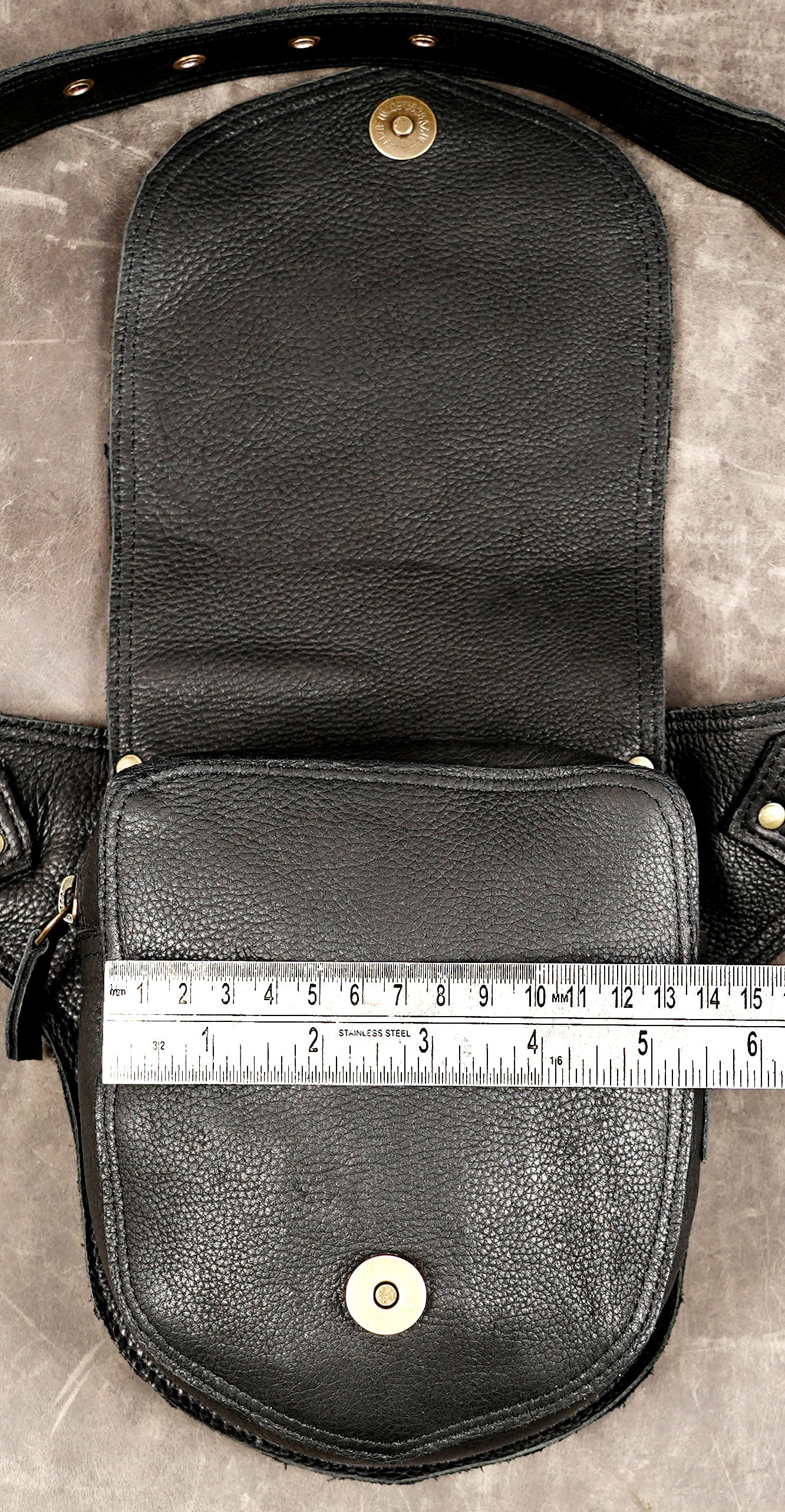 Boho leather hip pouch with studded flap and adjustable waistband