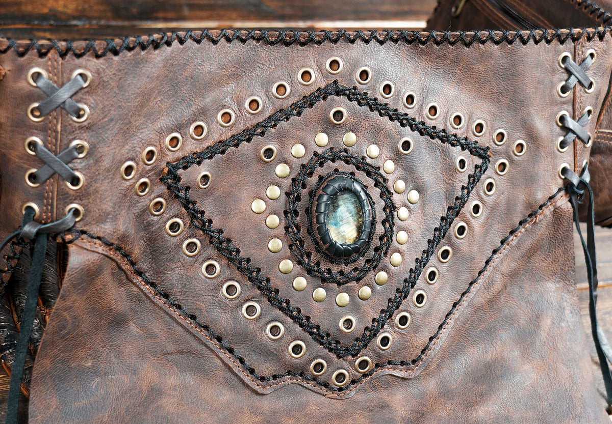 Boho leather mini skirt with gemstone centerpiece and grommets