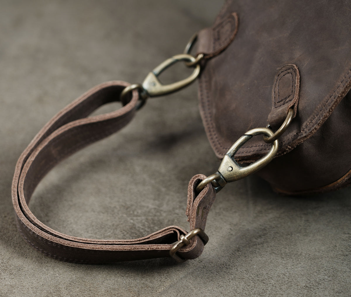 Boho leather waist bag with tooled edges and crystal stone