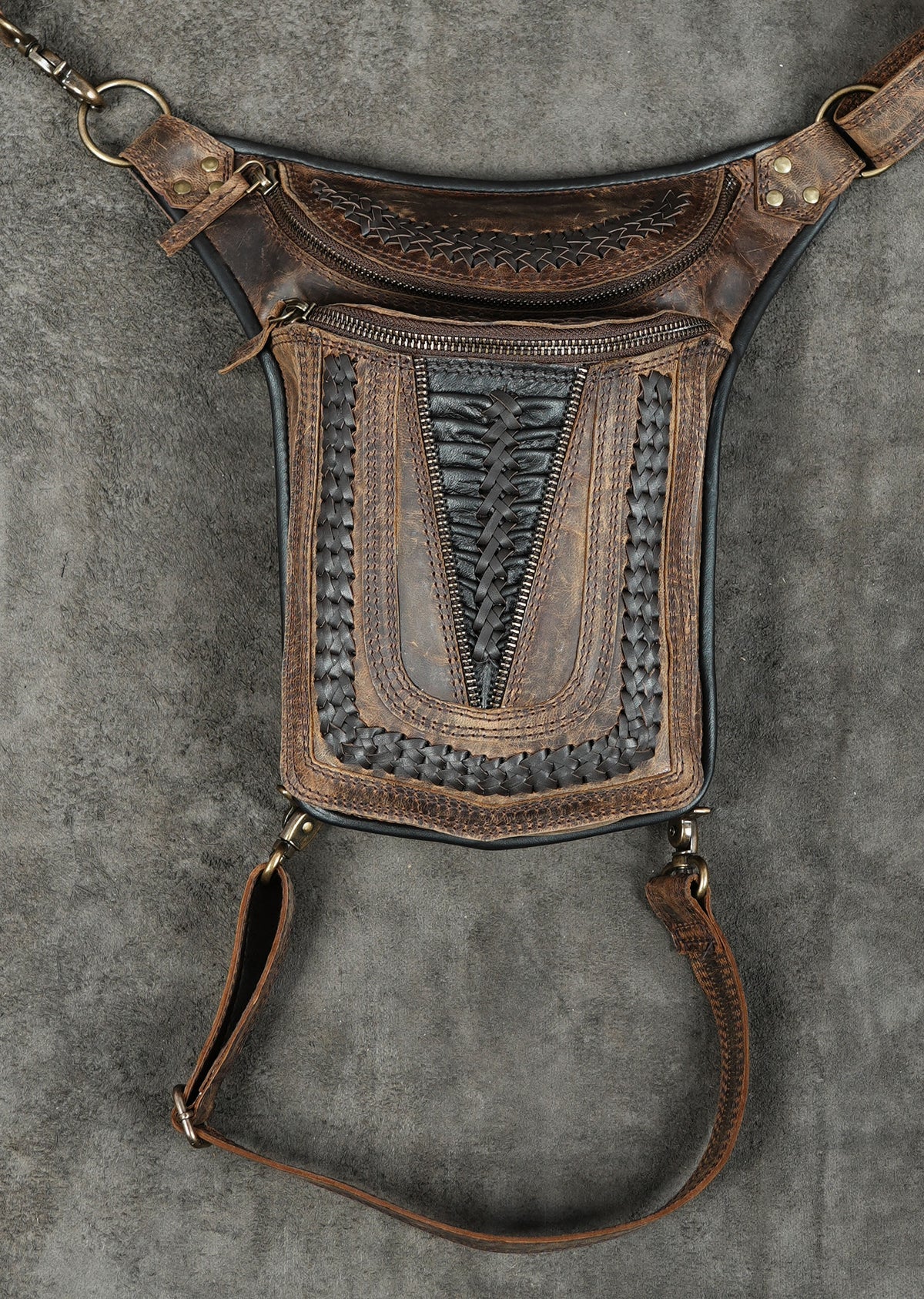 Brown leather hip holster pouch on gray background