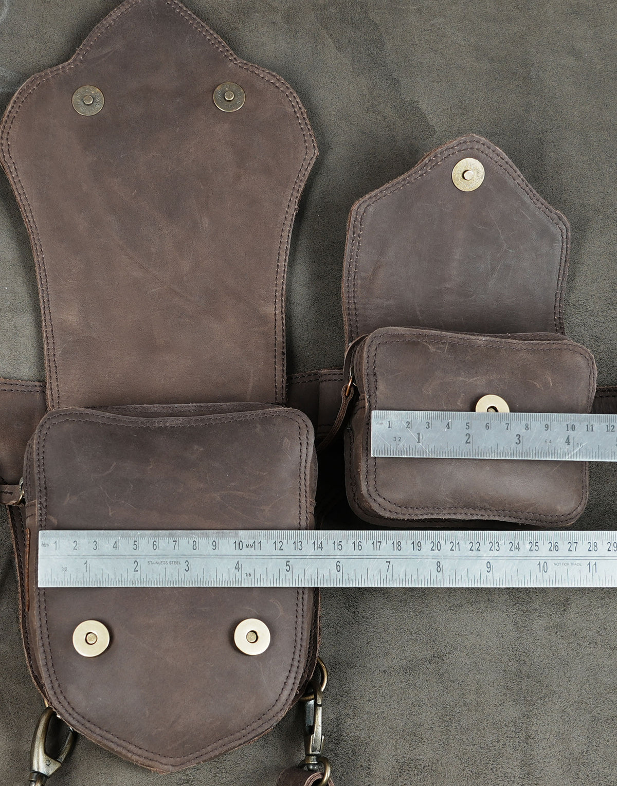 Brown leather medicine bag with gemstone and leg strap detail