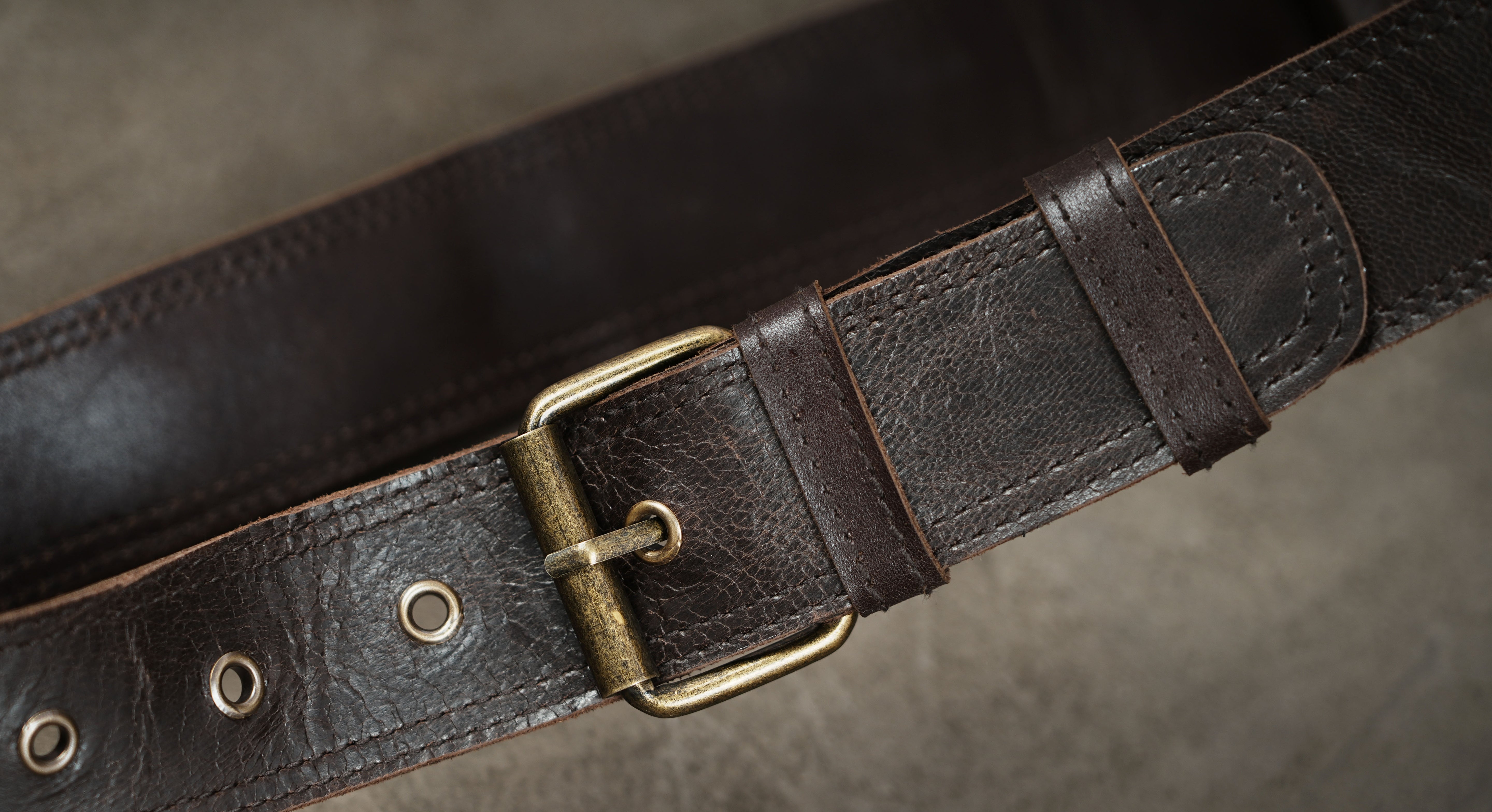 Brown leather thigh bag with secure pocket and adjustable straps