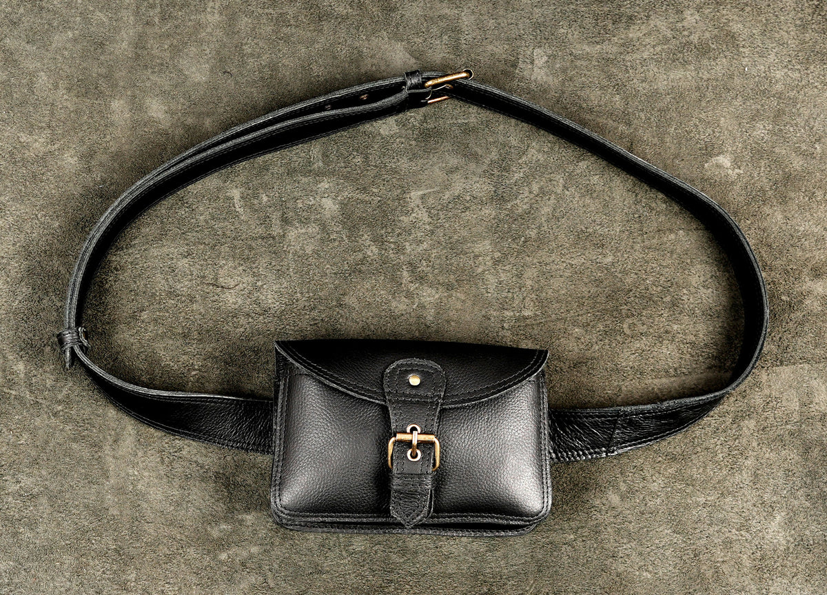 Black leather utility pack designed for crossbody and waist wear