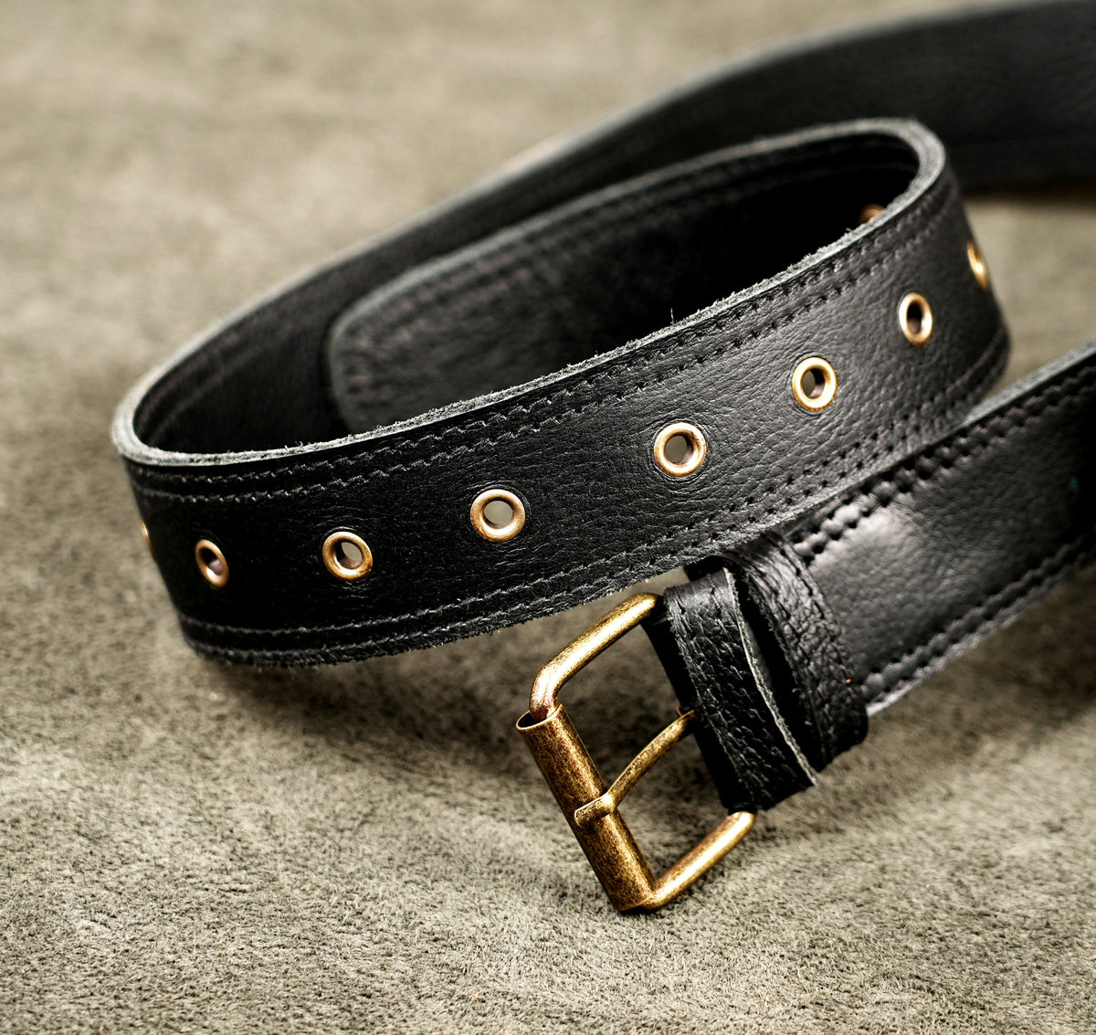 Minimalist black leather belt bag for women and men with adjustable strap
