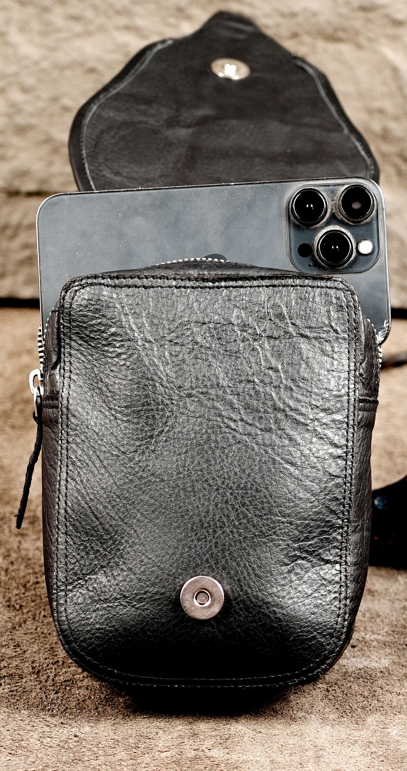 Compact black leather belt bag for travel and festivals