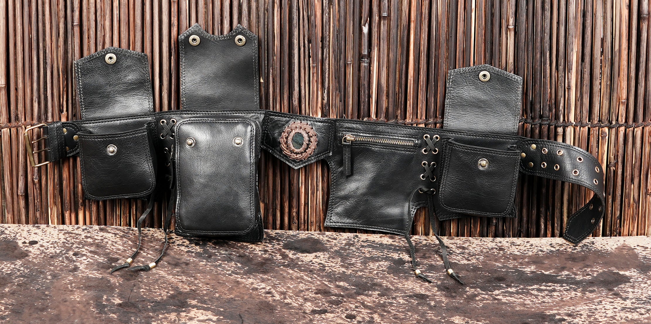 Genuine leather hip belt with multiple compartments and lace-up sides