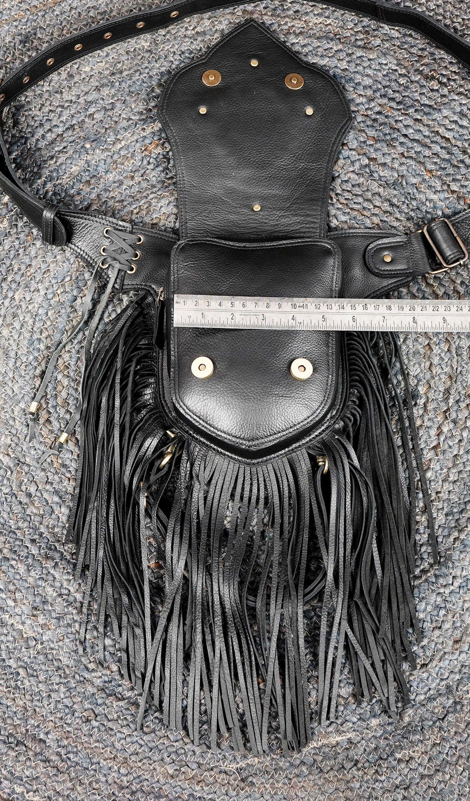 Women’s boho leather belt with fringe and ornate stone centerpiece