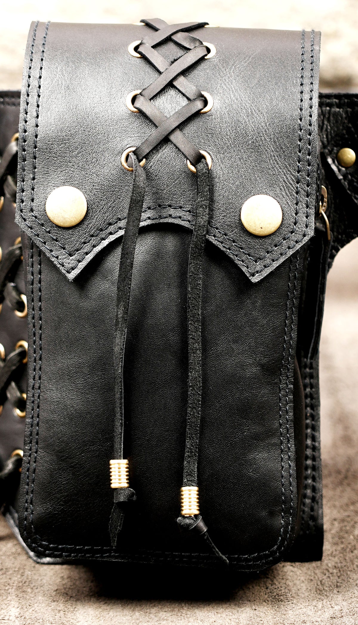 Handmade black leather hip belt with multiple pockets and adjustable buckle