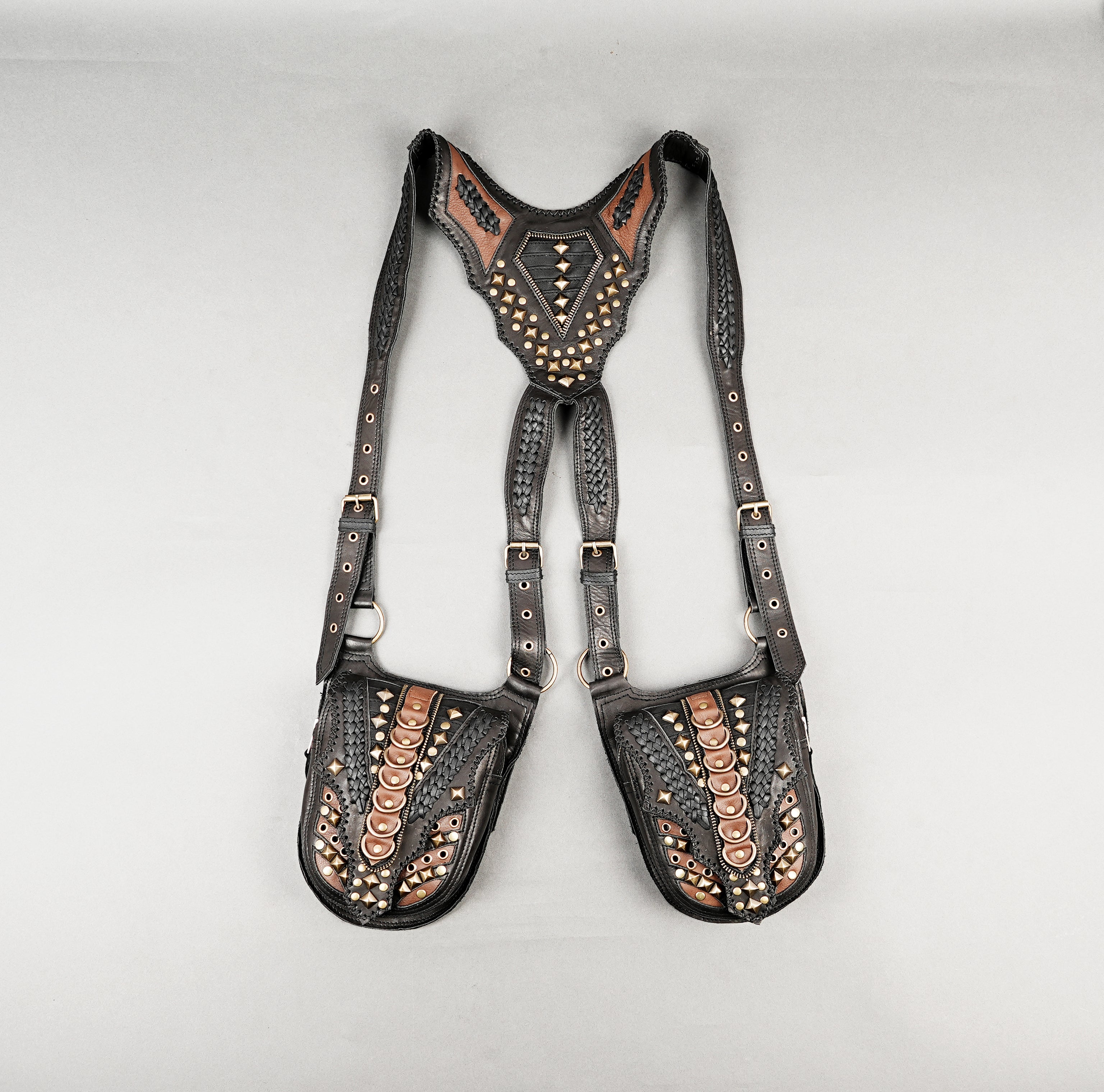 Utility leather holster harness with strong stitching and metal fittings