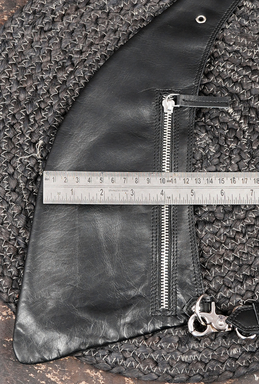 Leather shoulder rig with adjustable straps and secure zip closures