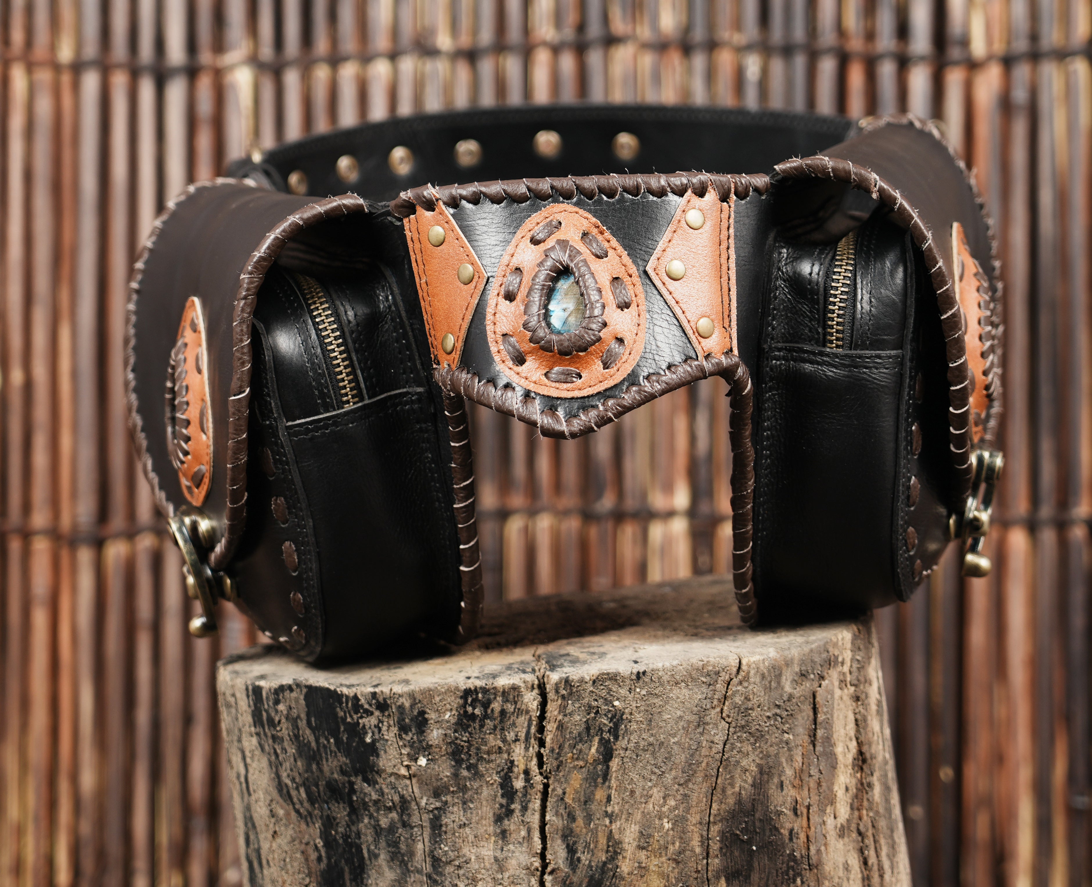 Black leather hip belt with dual pouch storage and rivet accents