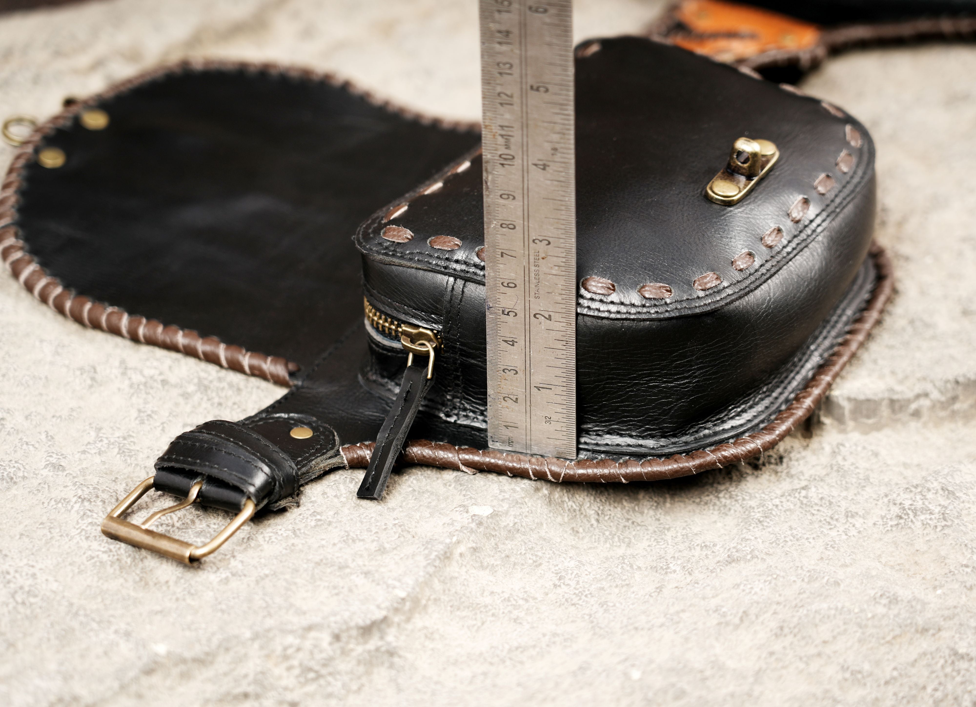 Rustic leather waist belt with handcrafted stitching and hardware