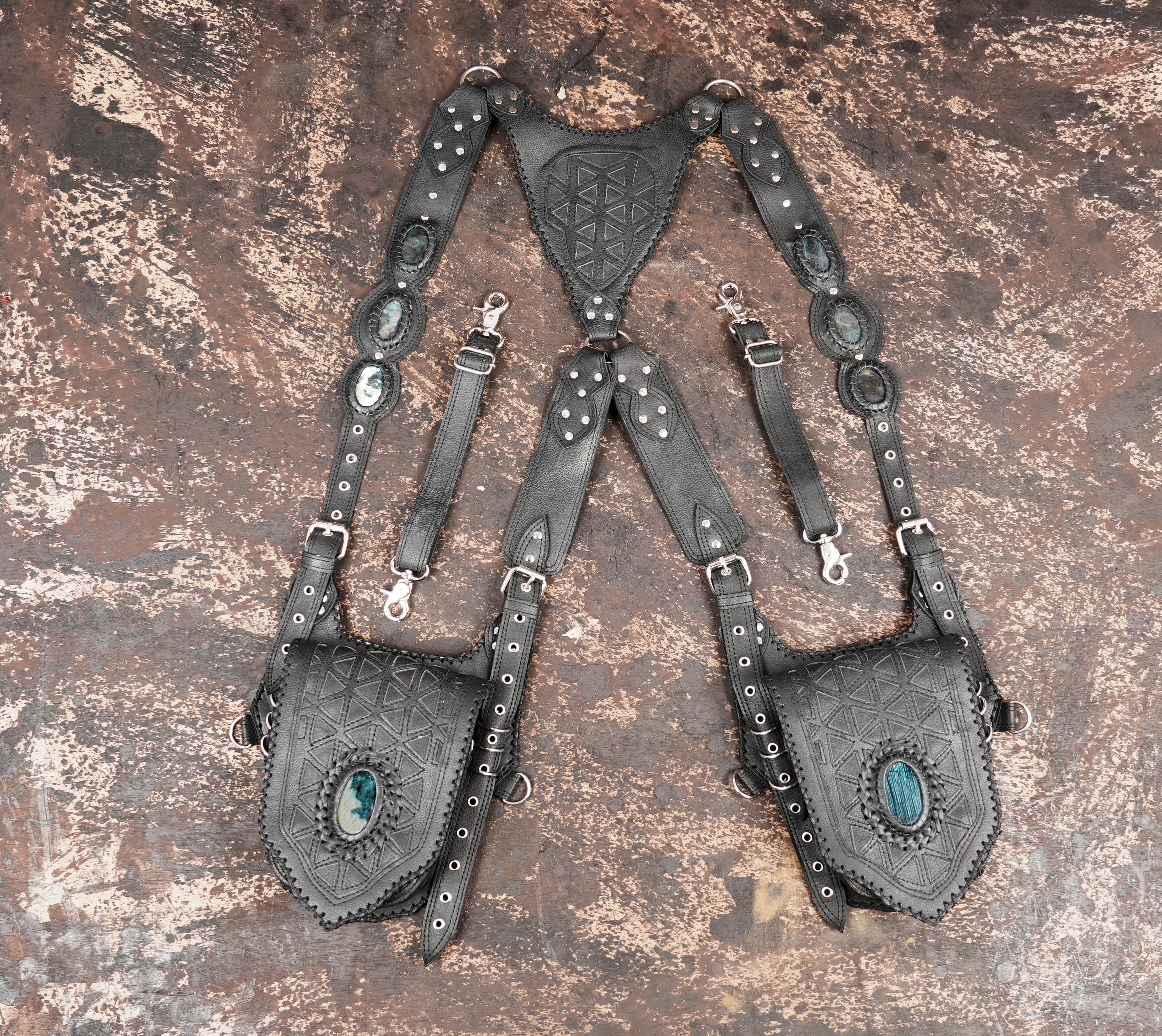 Handmade black leather shoulder holster with geometric embossed design