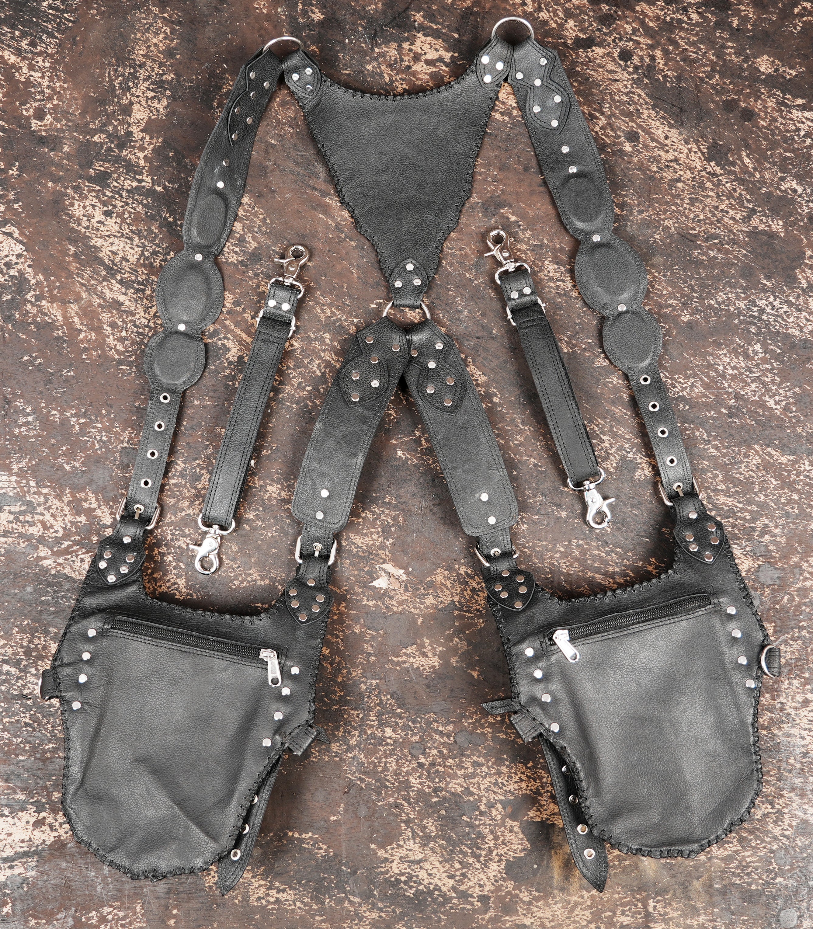 Hand tooled leather shoulder holster with artisan craftsmanship