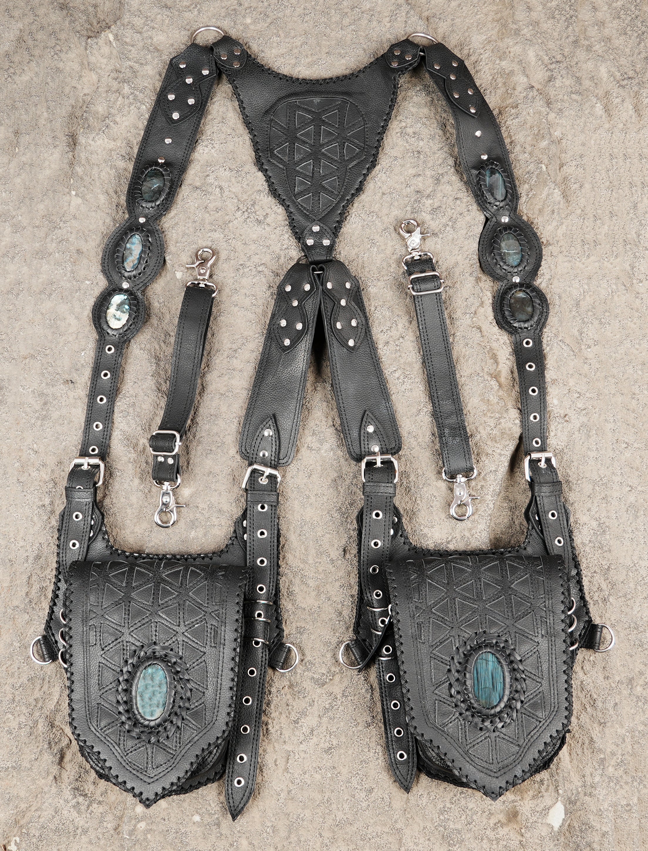 Black leather holster with symmetrical pouch layout and gemstone inlay