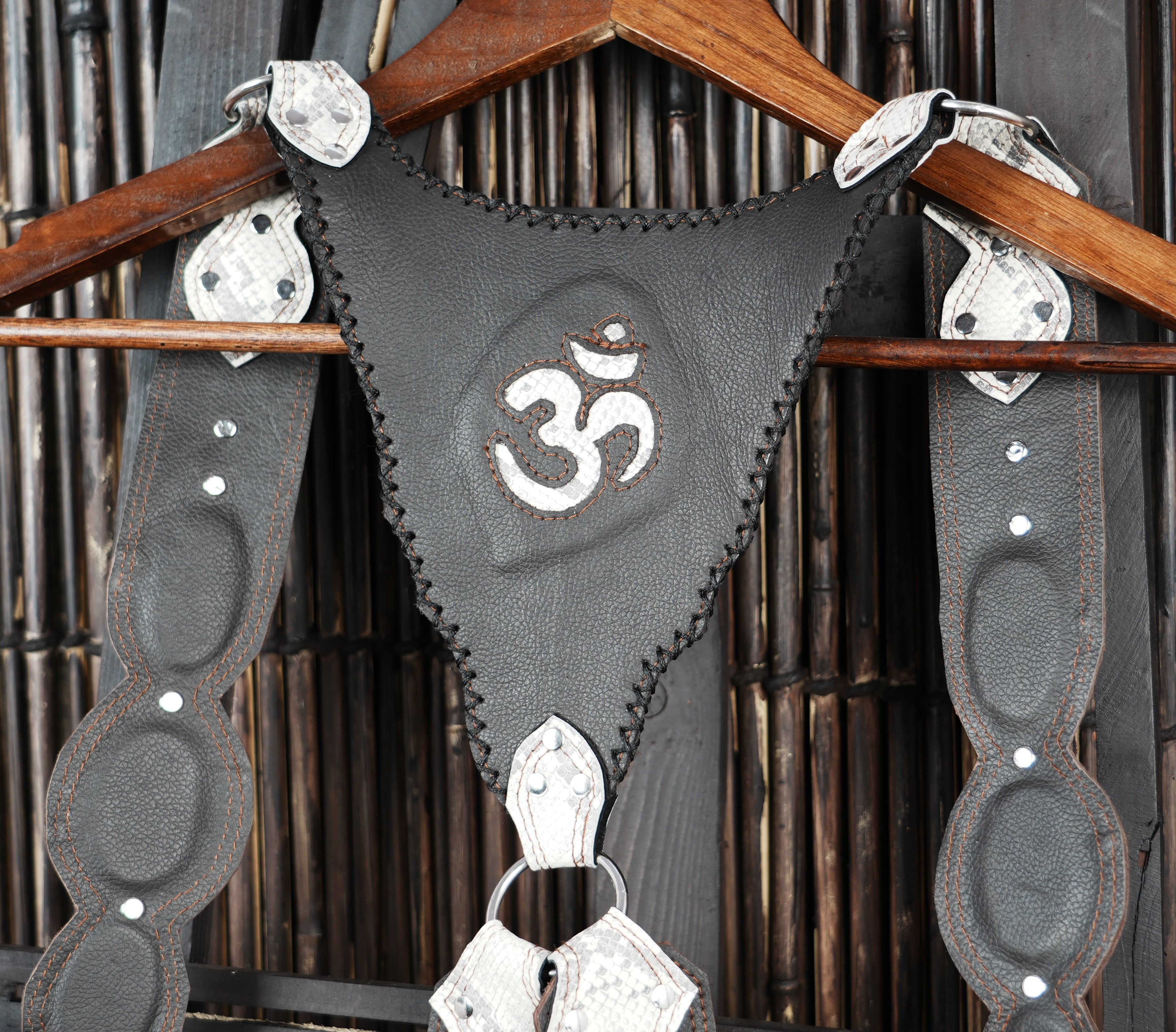 Custom leather shoulder holster with dual pouch design and stone accents