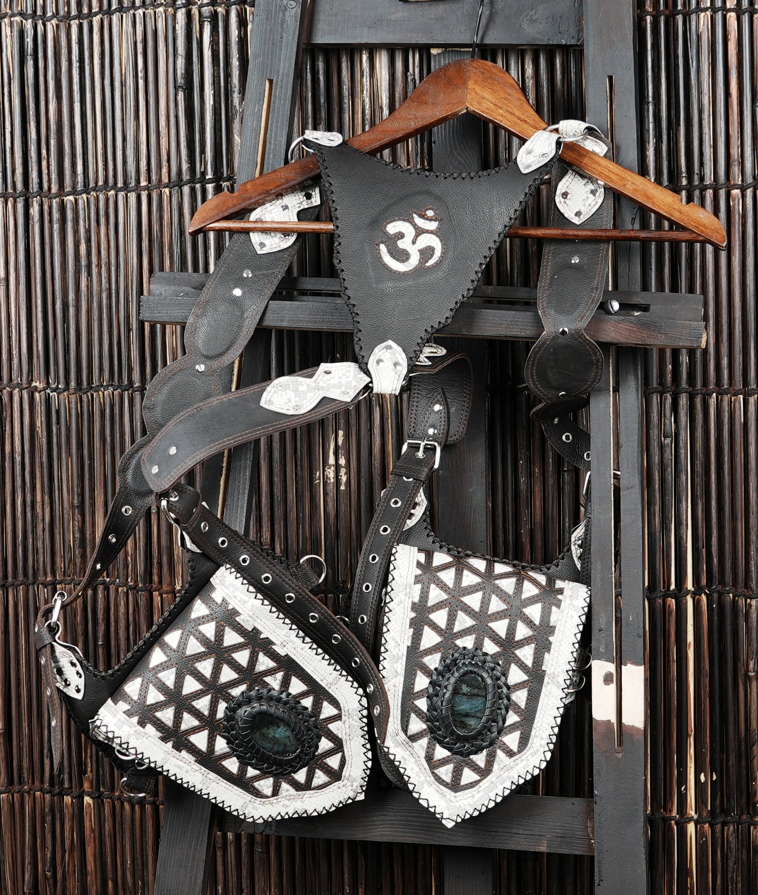 Ethnic leather shoulder holster with handcrafted stitching and stone details