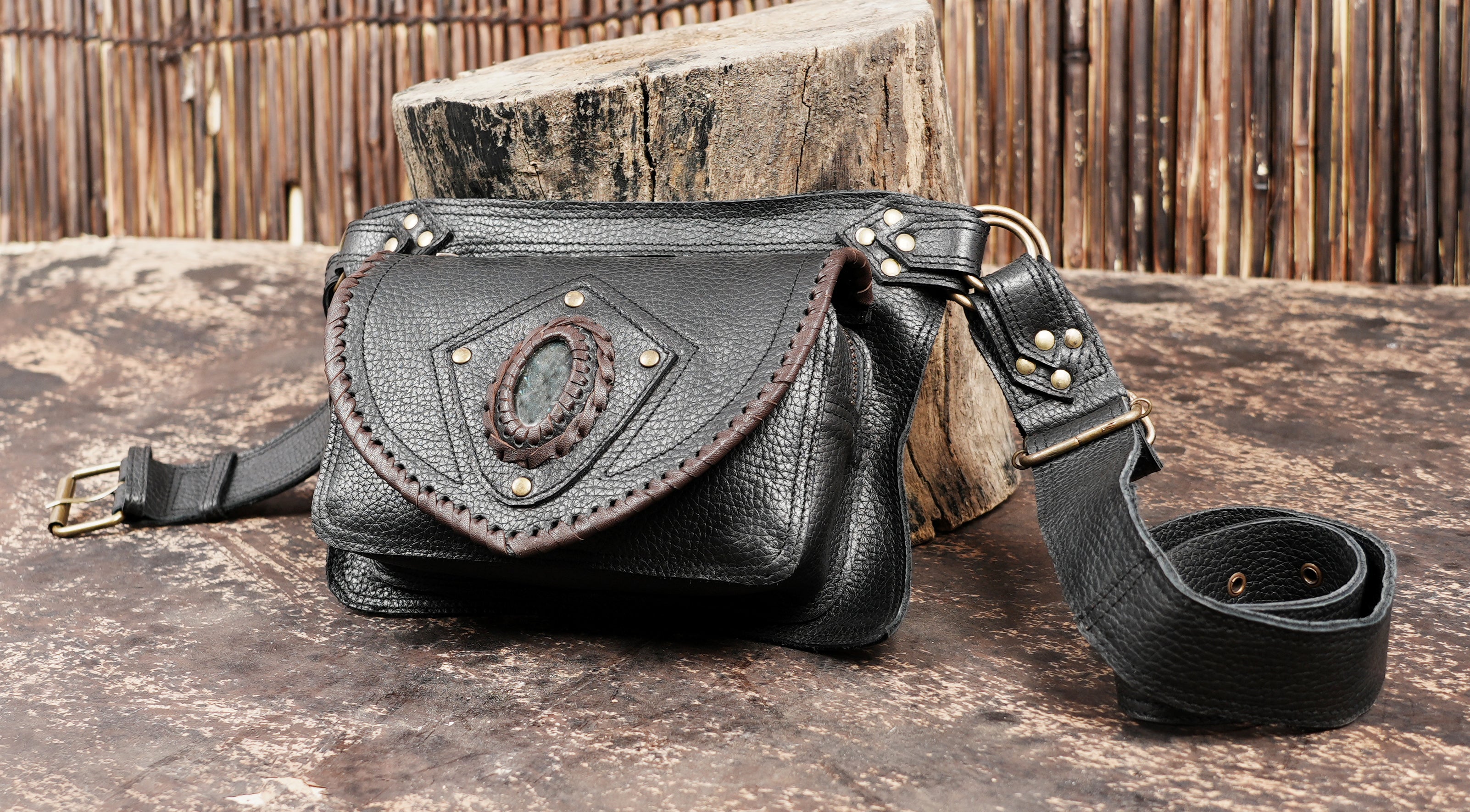 Leather waist bag with adjustable belt and secure flap