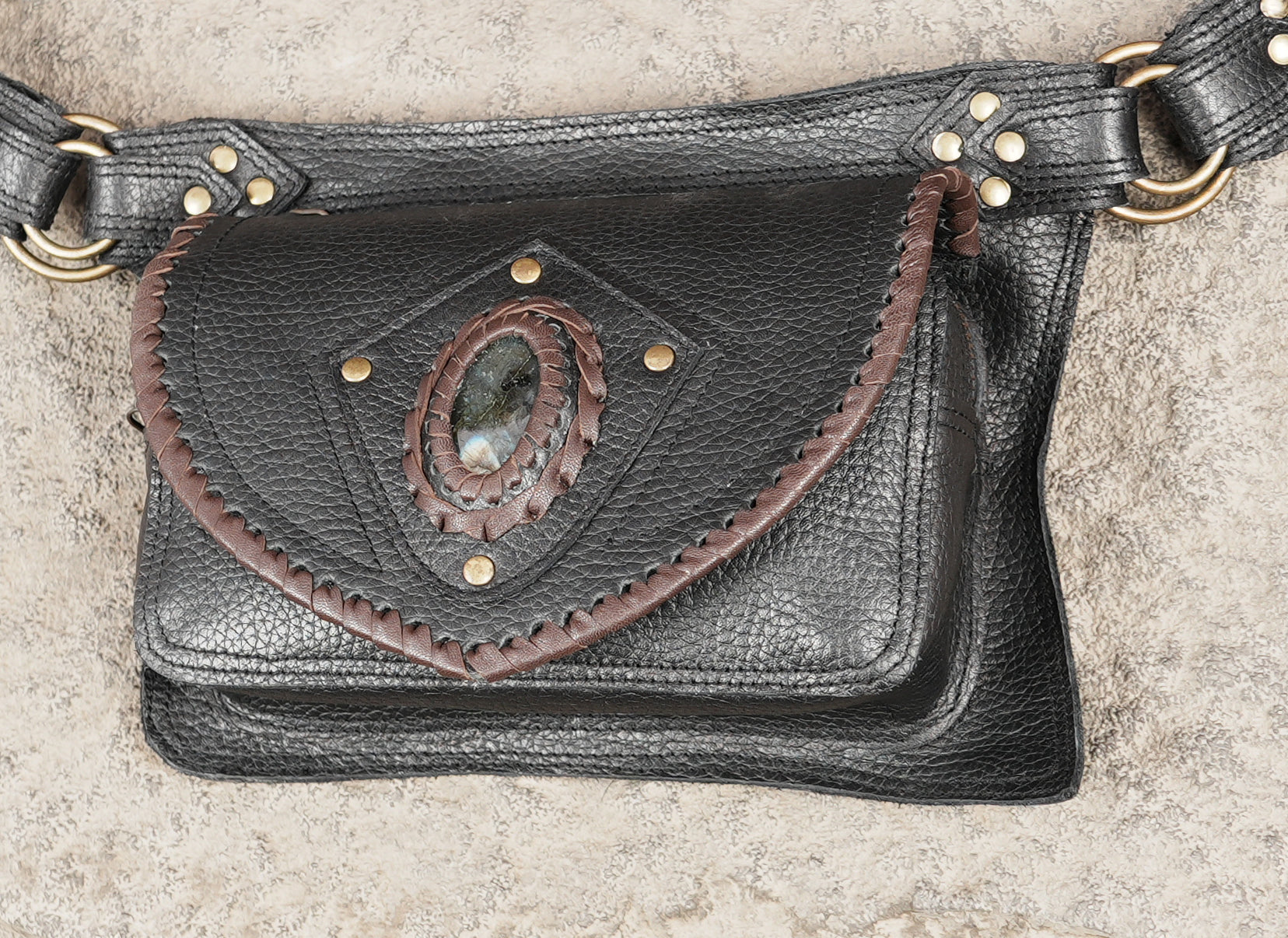 Leather waist bag with adjustable strap and metal fittings