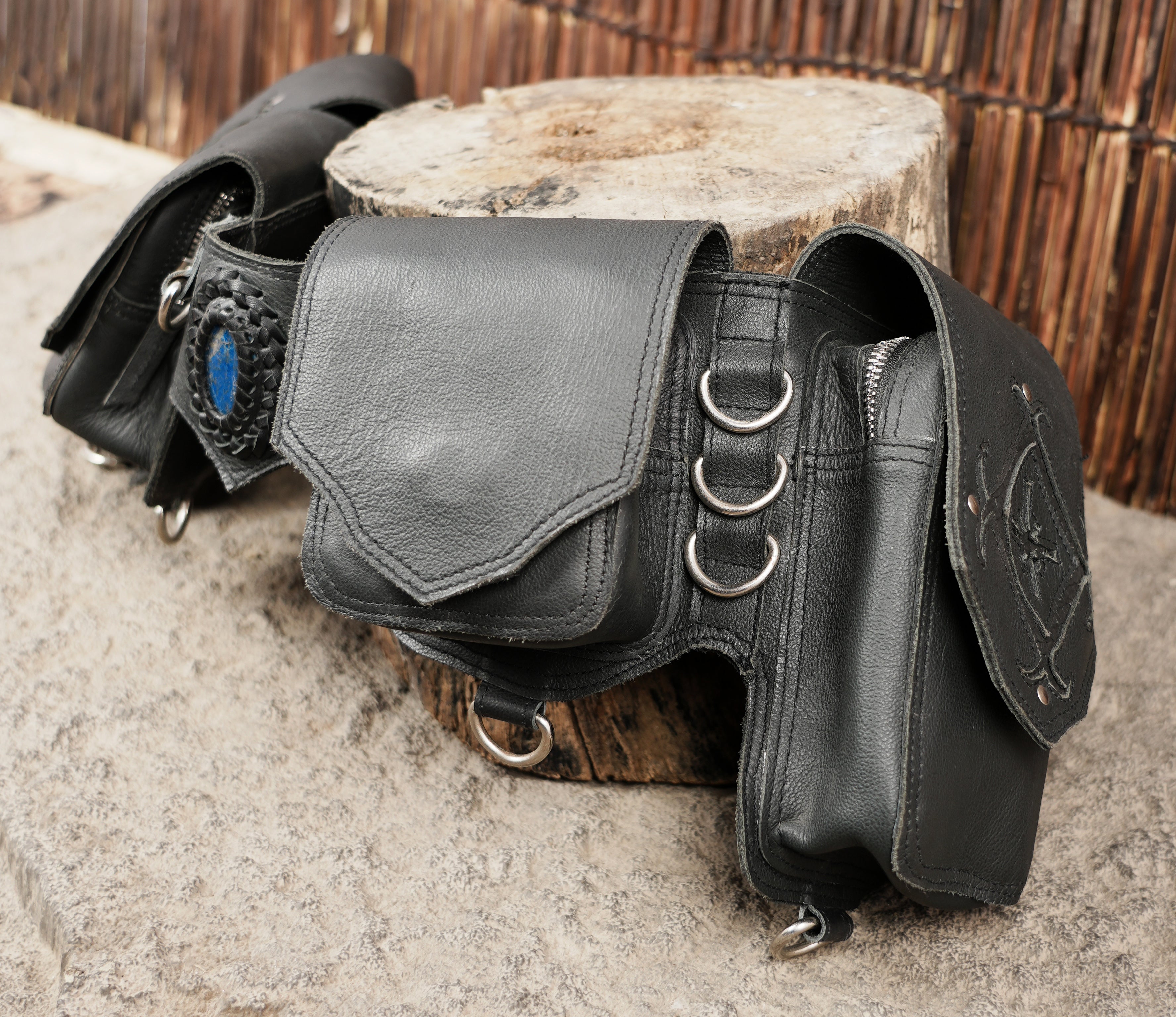 Black leather waist belt with metal ring details