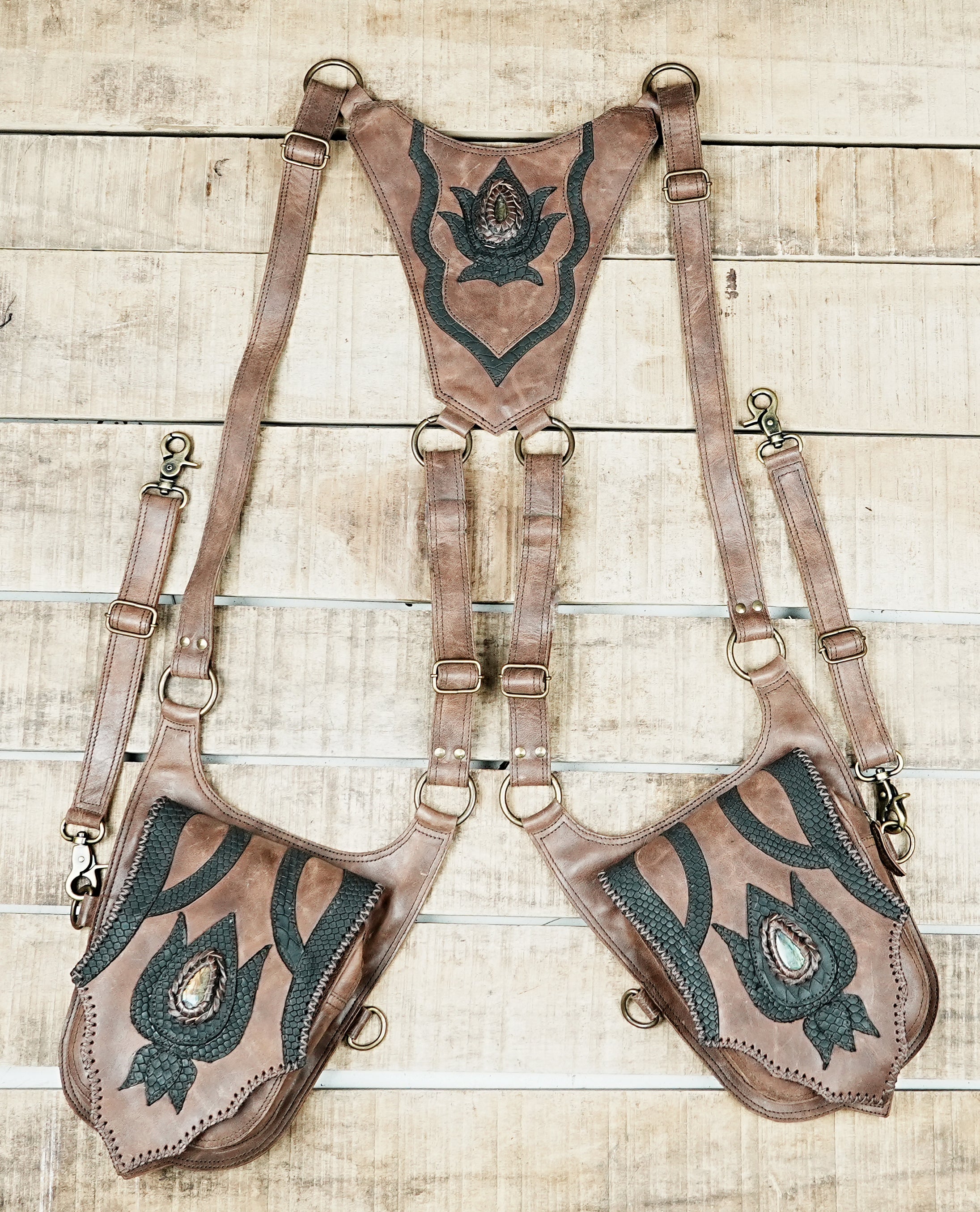 Handcrafted leather leg holster with decorative stone centerpiece