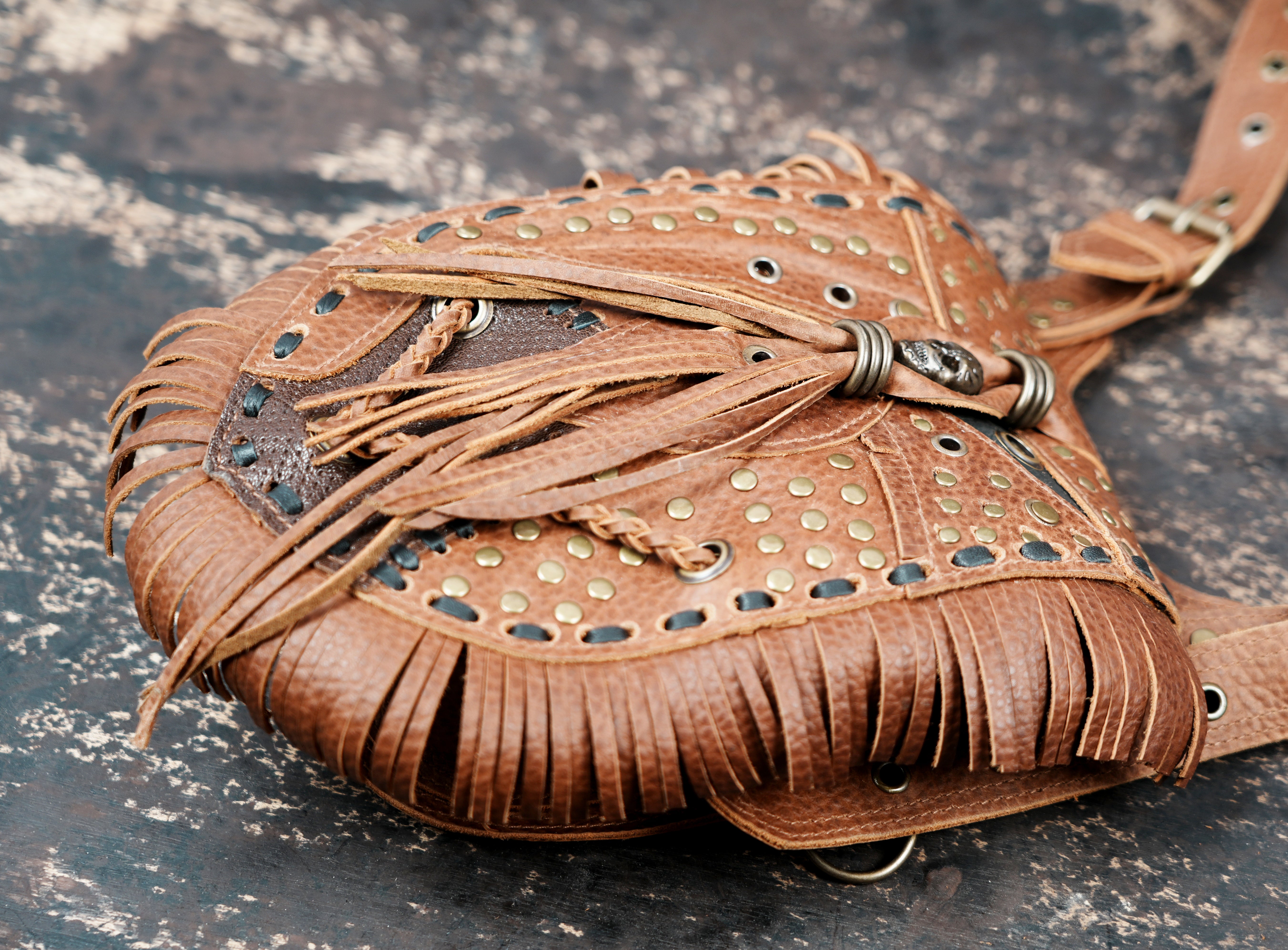 Brown leather utility holster with decorative fringe design