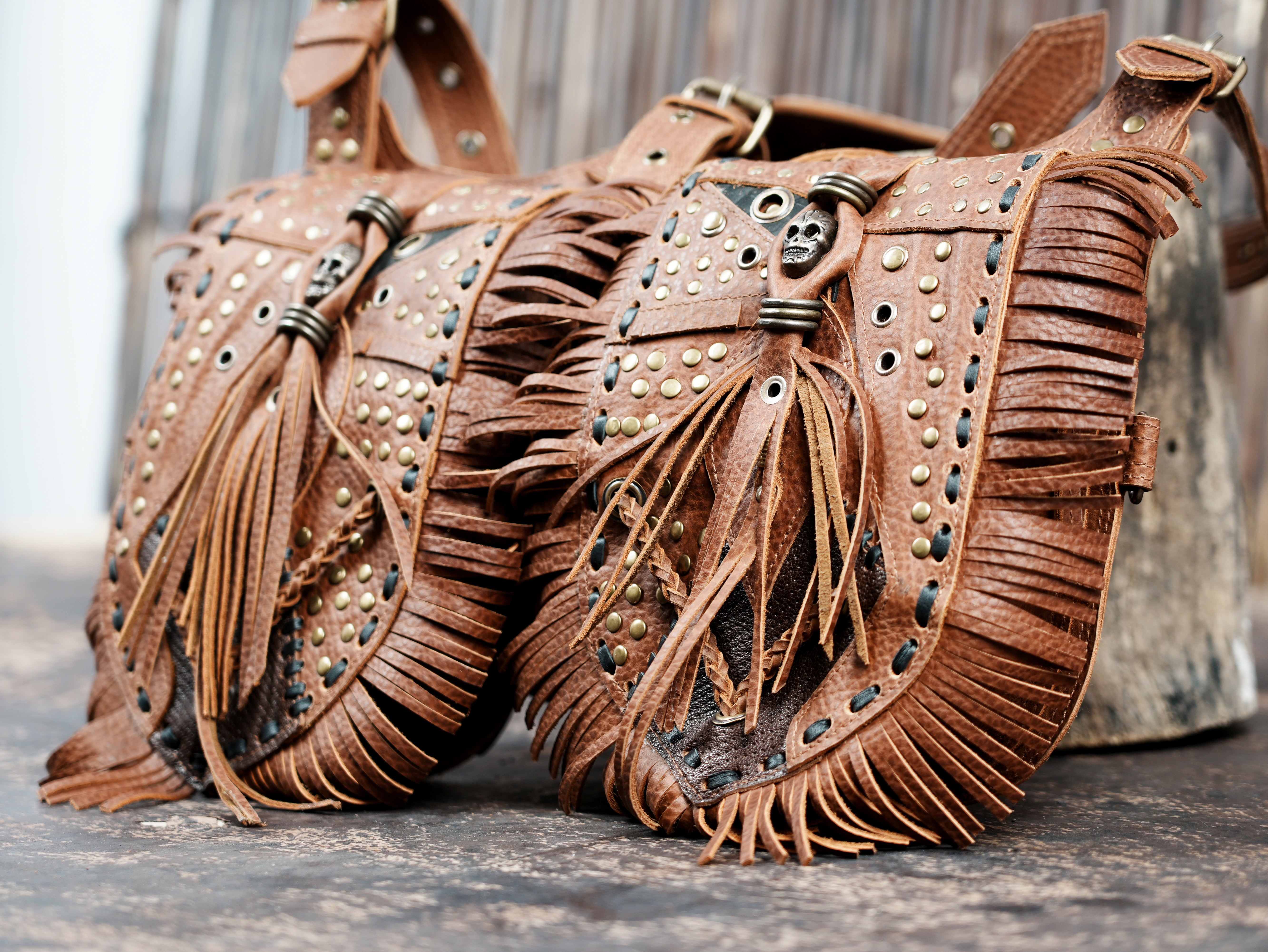 Leather holster pouch set with studded and fringed details