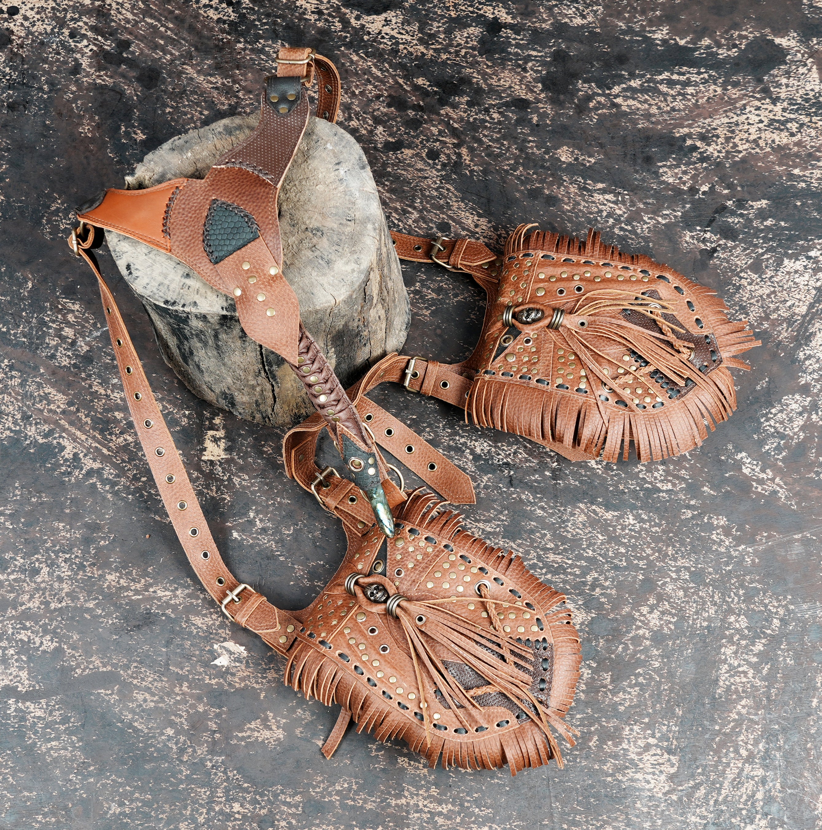 Handcrafted leather shoulder holster with detailed cutwork