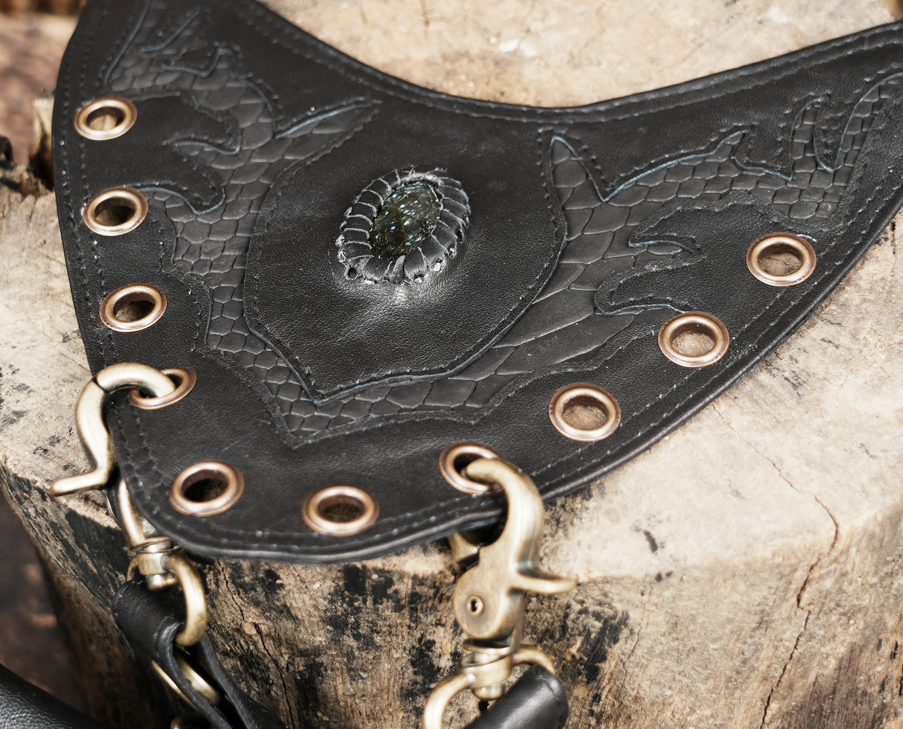 Leather shoulder holster harness with metal rivet detailing