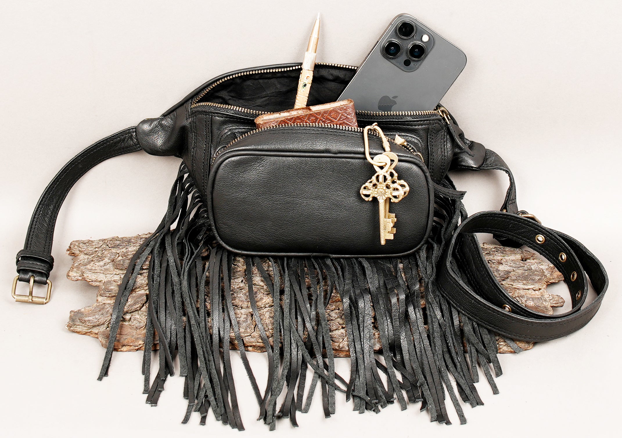 Black fringed waist bag with secure zipper closure