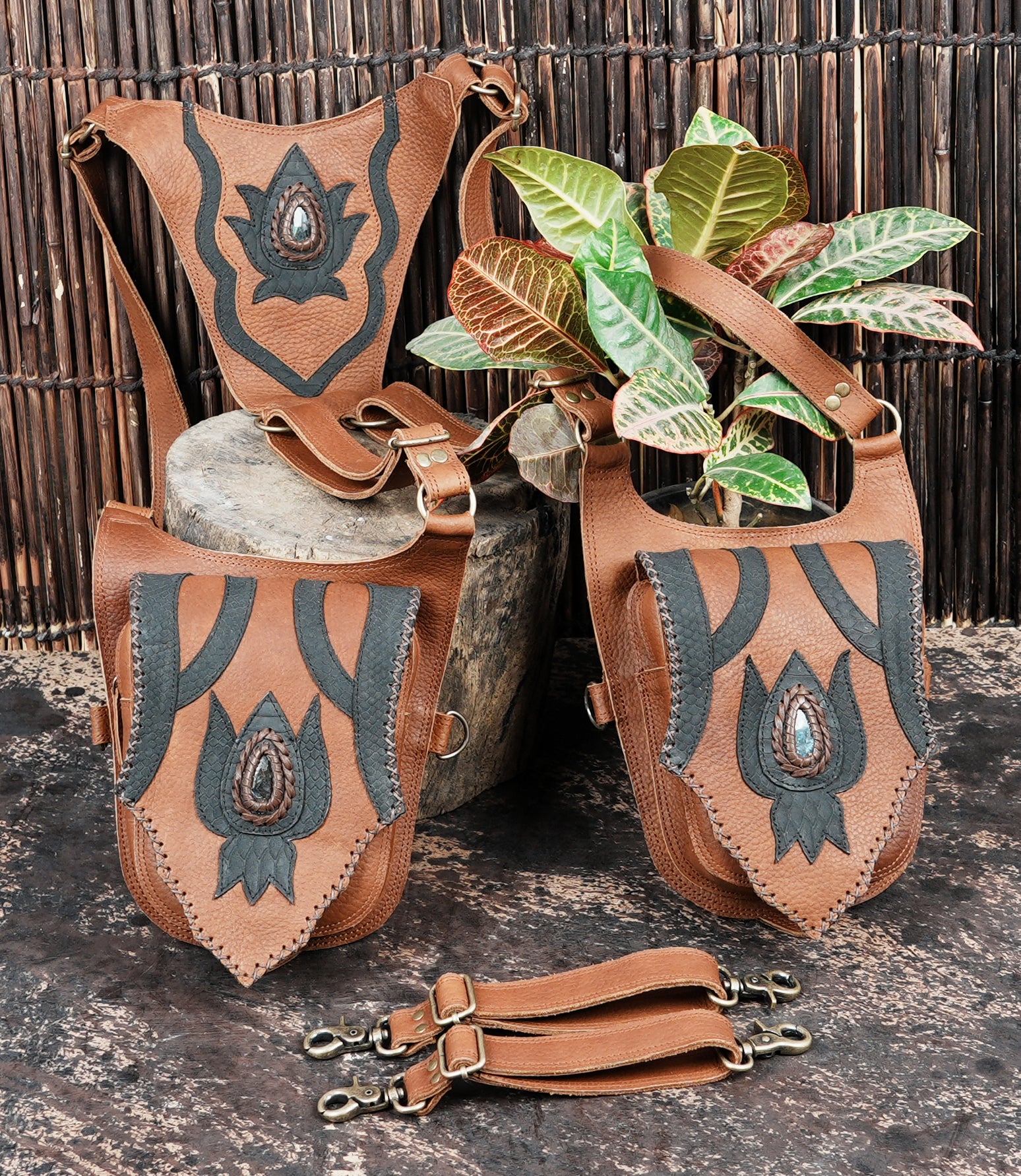 Brown leather festival holster with lotus motif and metal hardware