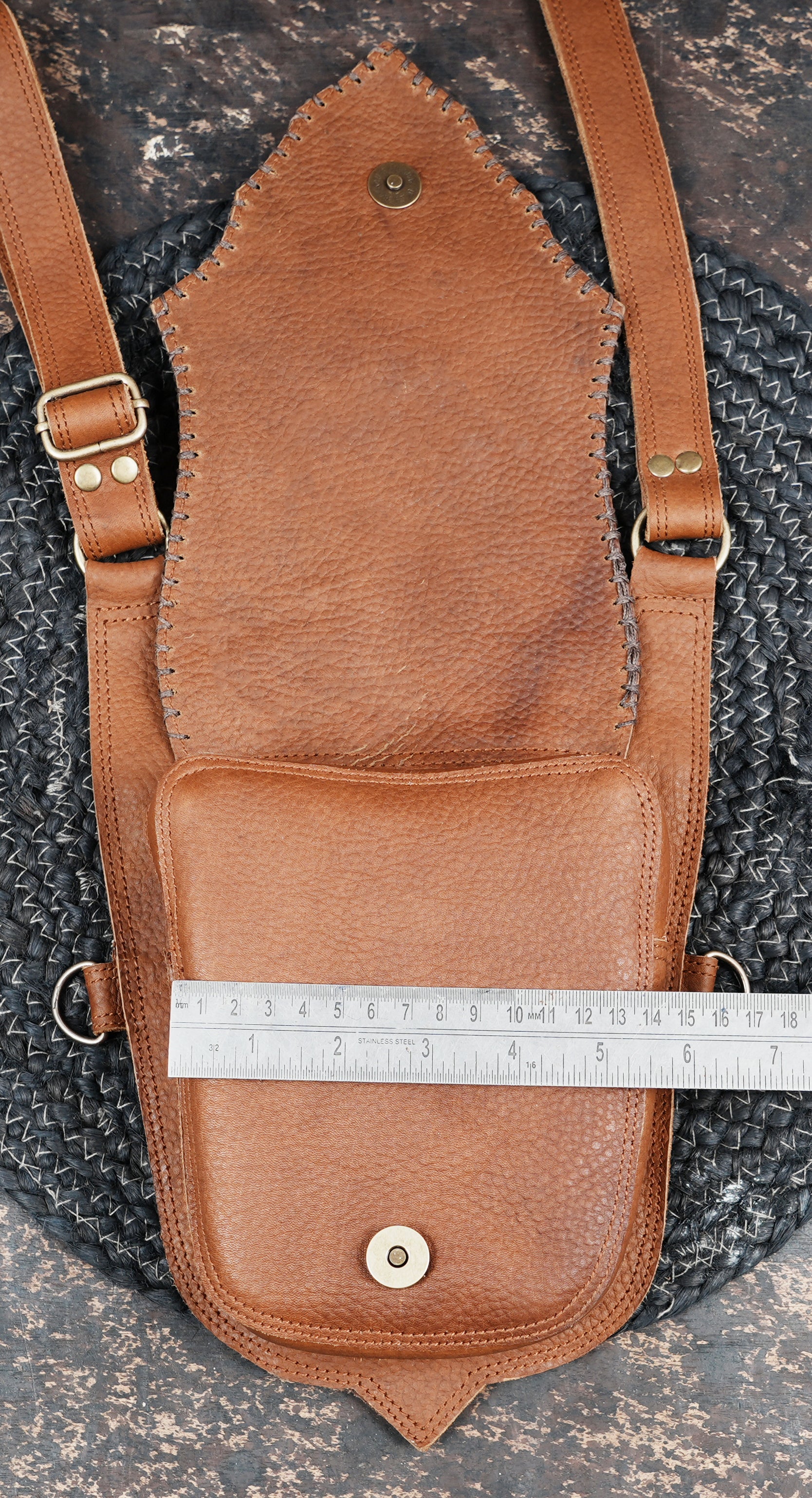 Brown leather holster belt with lotus pattern and metal clips